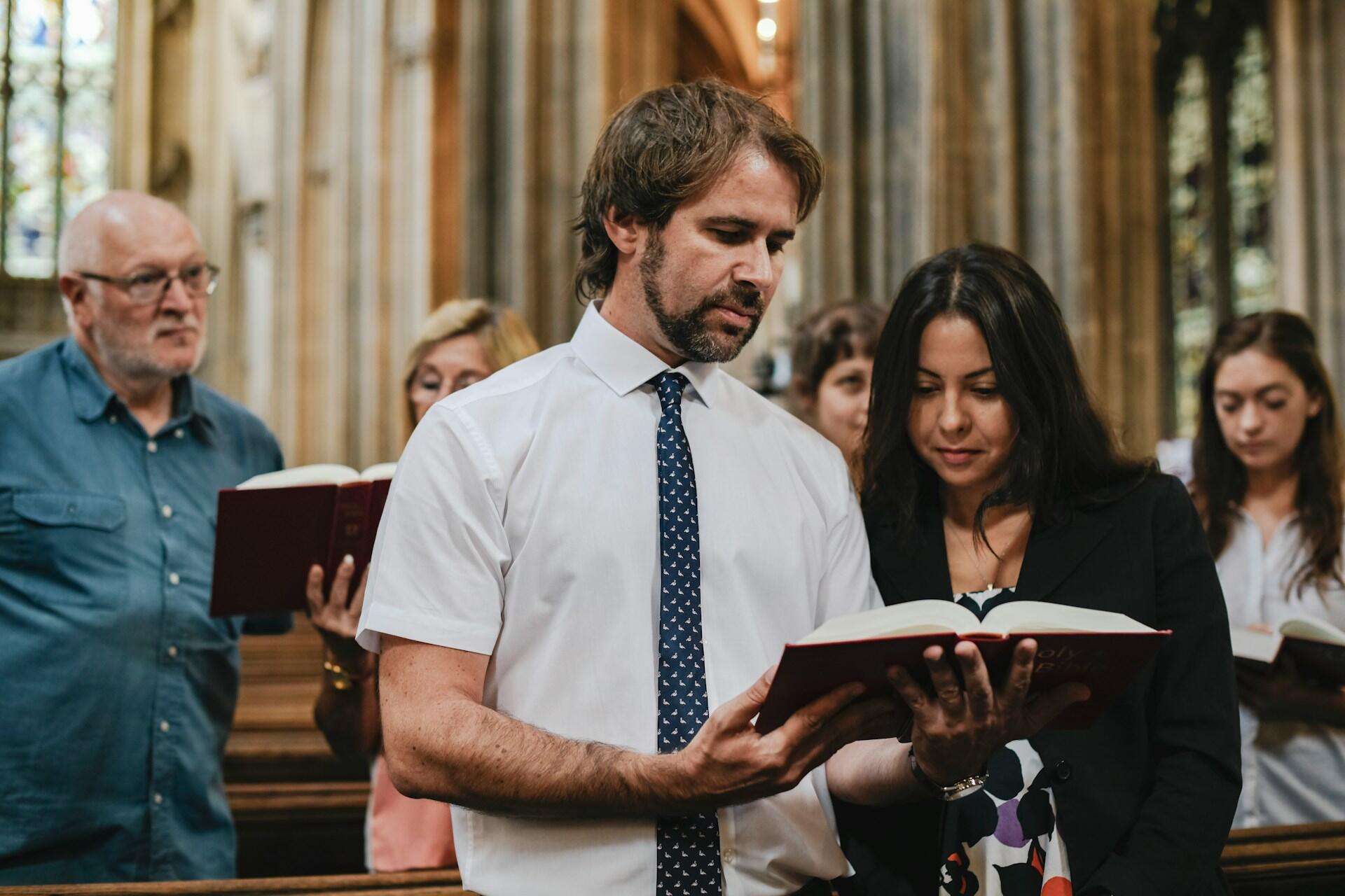 man and woman attending easter church service