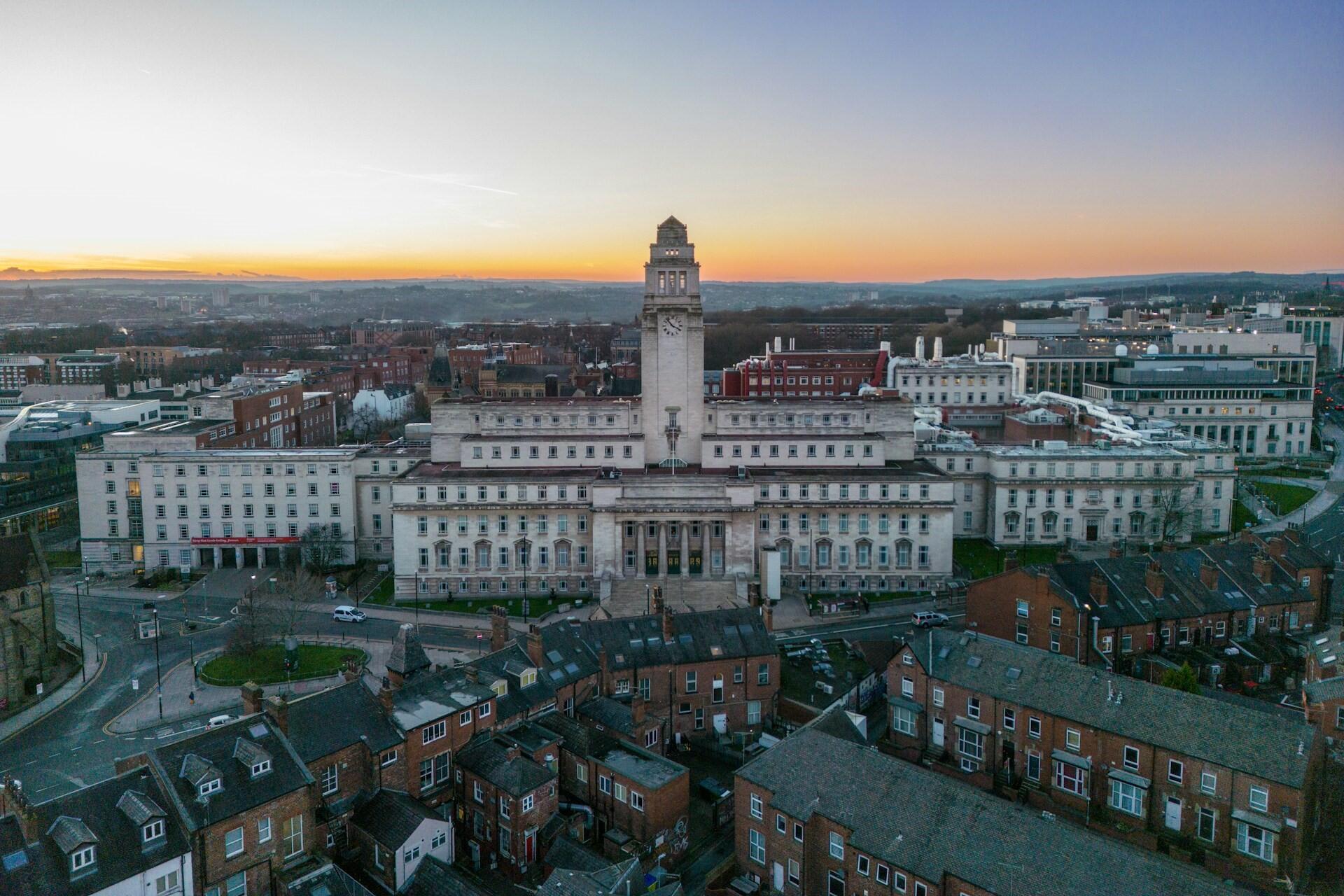 Aerial view of the University of Leeds campus with the Parkinson Building clock tower at sunrise