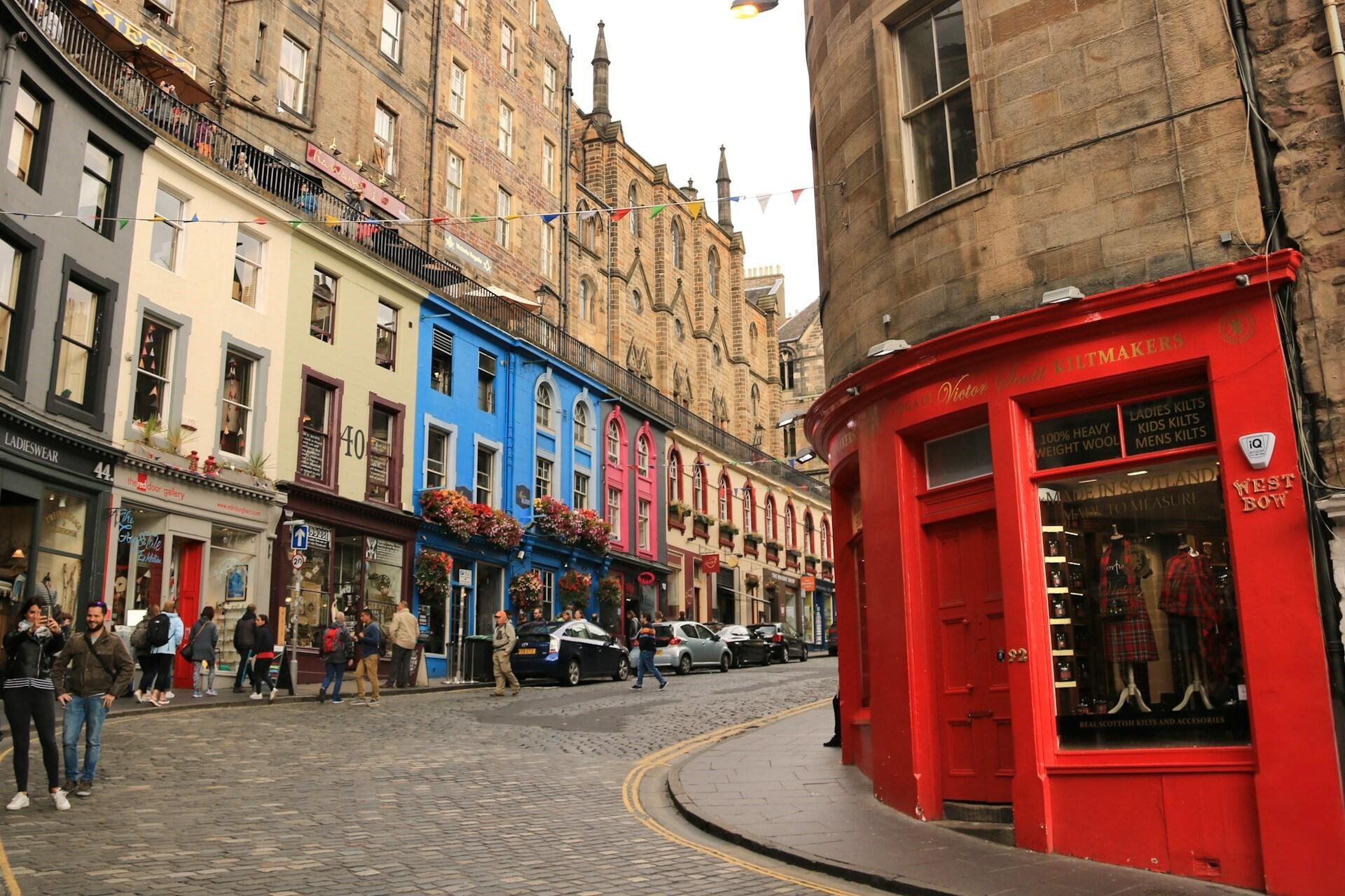 Colorful buildings and shops along Victoria Street in Edinburgh Old Town