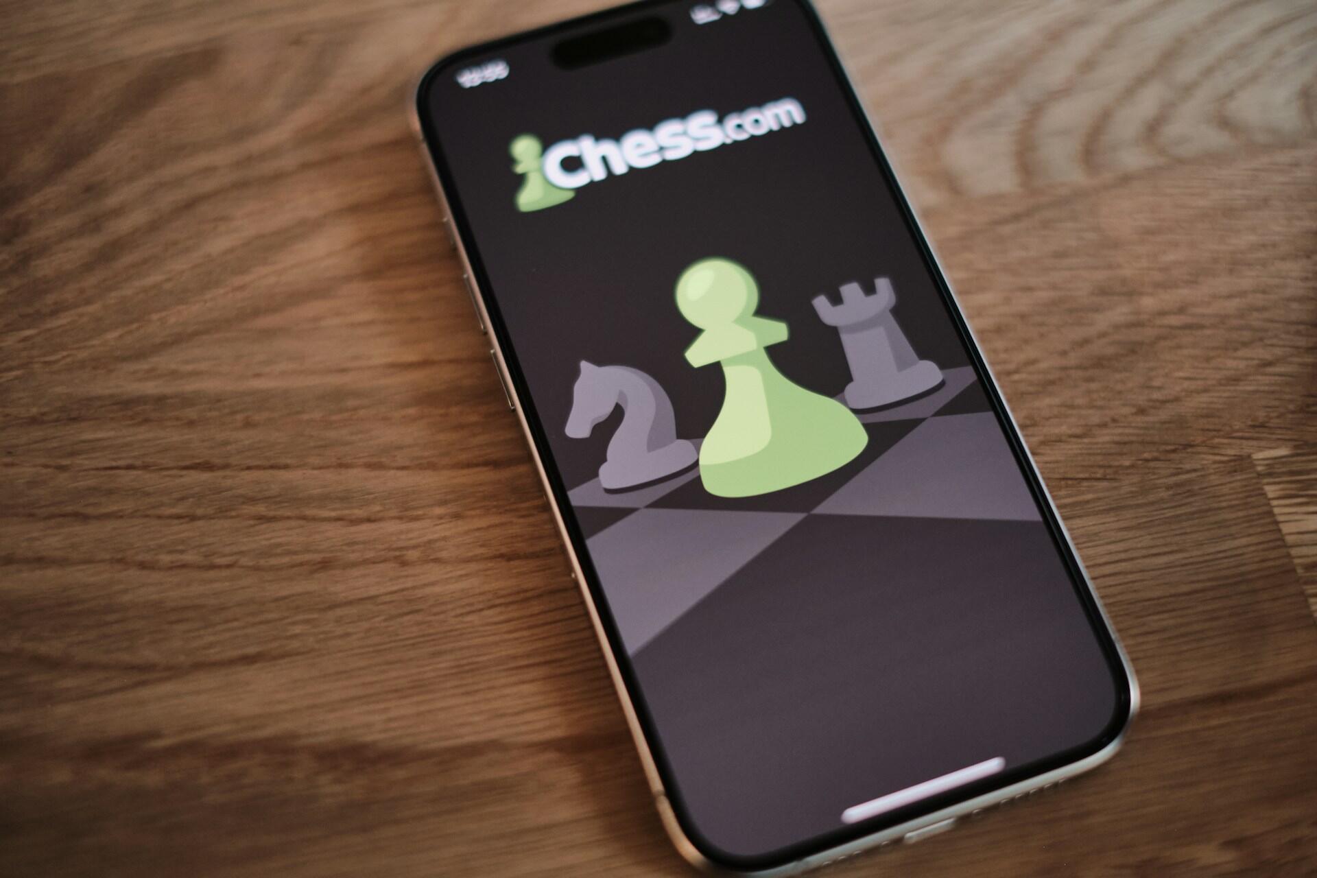 Smartphone displaying the Chess.com app interface used for solving chess puzzles and tactics.