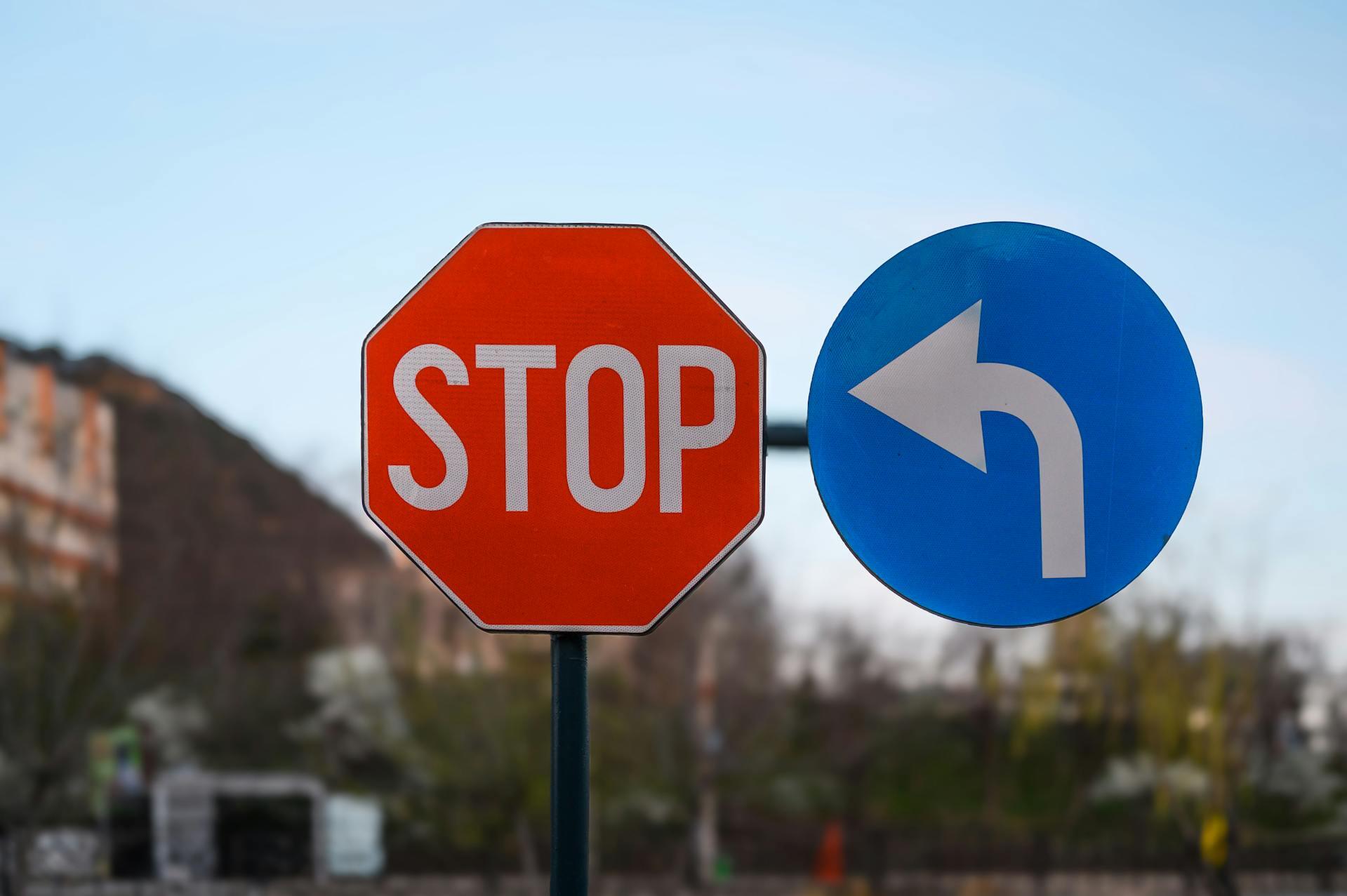 Two road signs: a red octagonal 