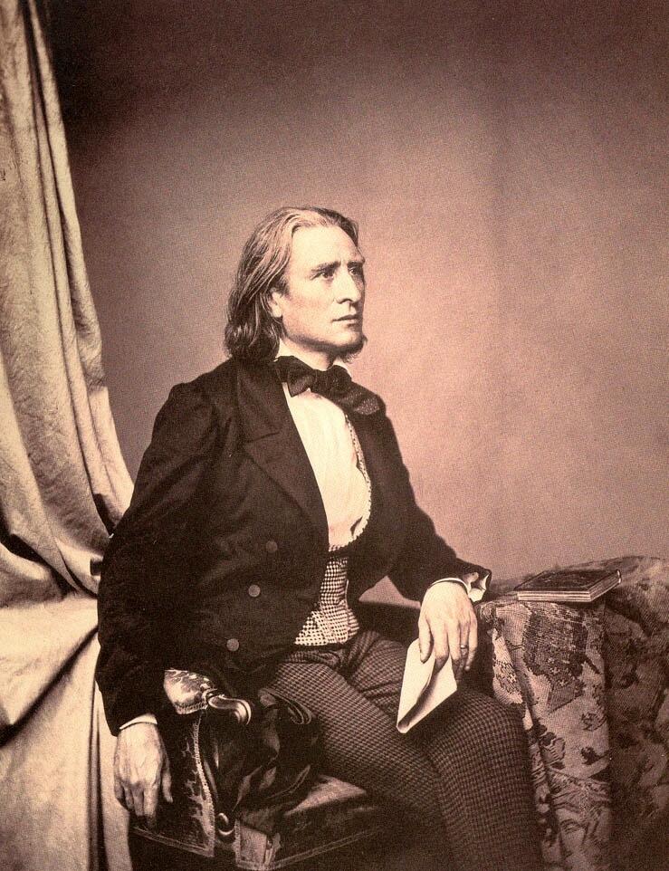 Vintage sepia image of a person in 19th-century formal attire seated with a letter in hand beside a table with a book.