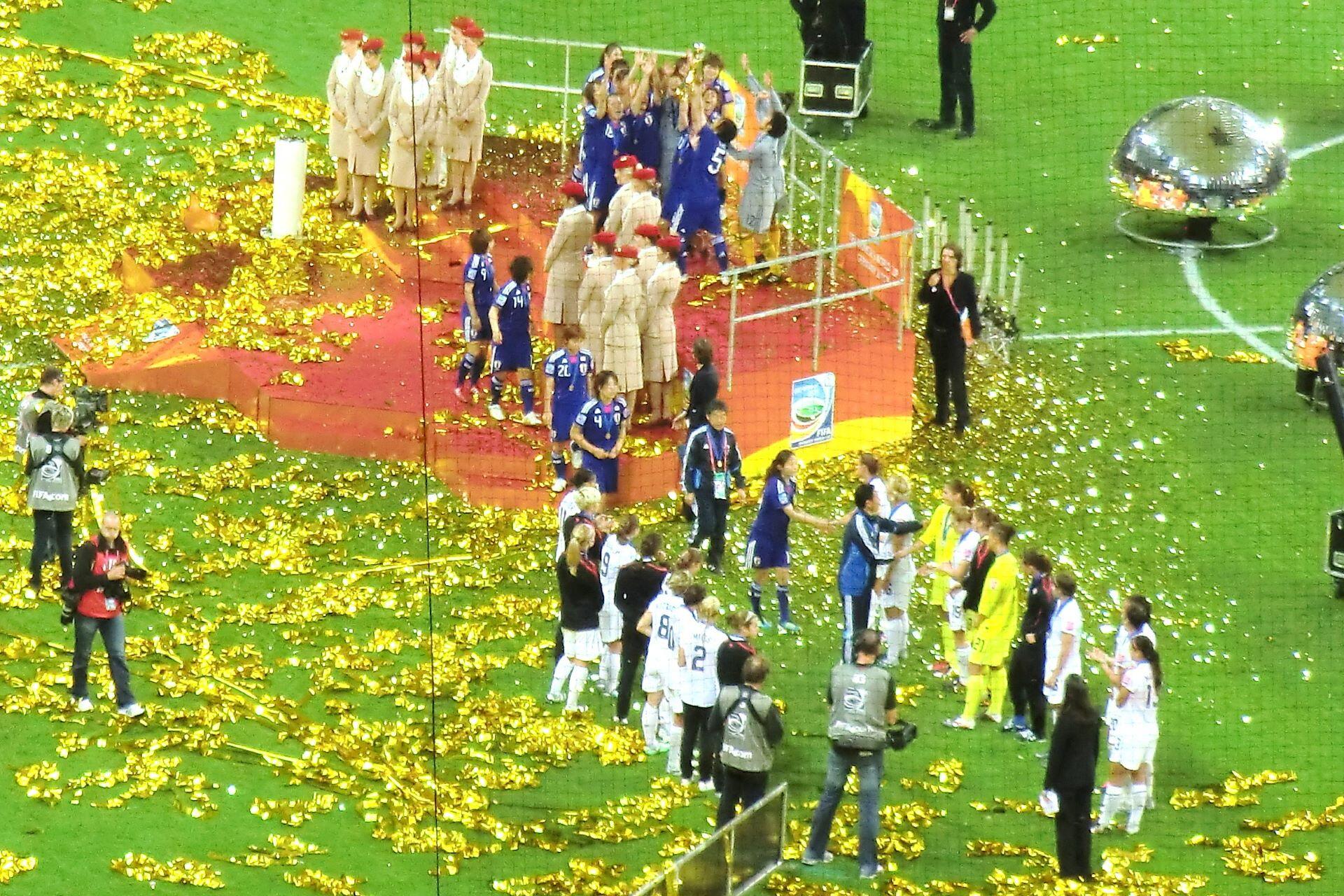 Japan players celebrating on the podium after winning the 2011 FIFA Women’s World Cup.