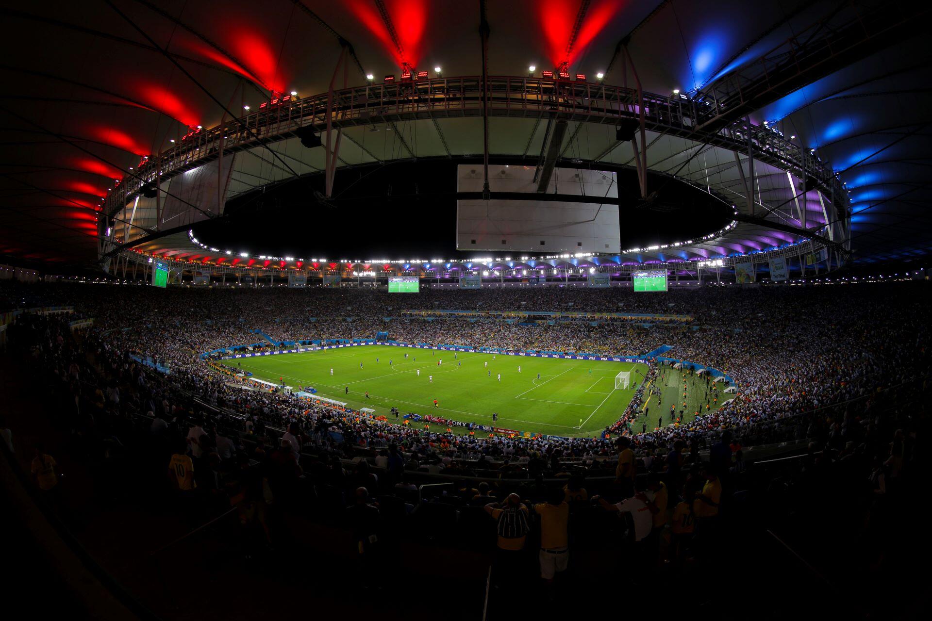 Germany and Argentina playing during the 2014 FIFA World Cup final in a packed stadium.