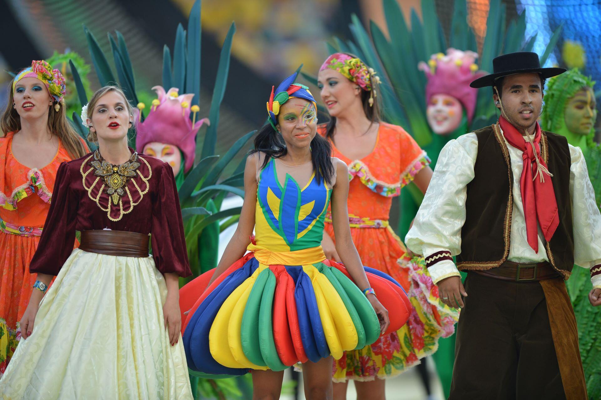 Performers in colourful costumes during the opening ceremony of the 2014 FIFA World Cup in Brazil.