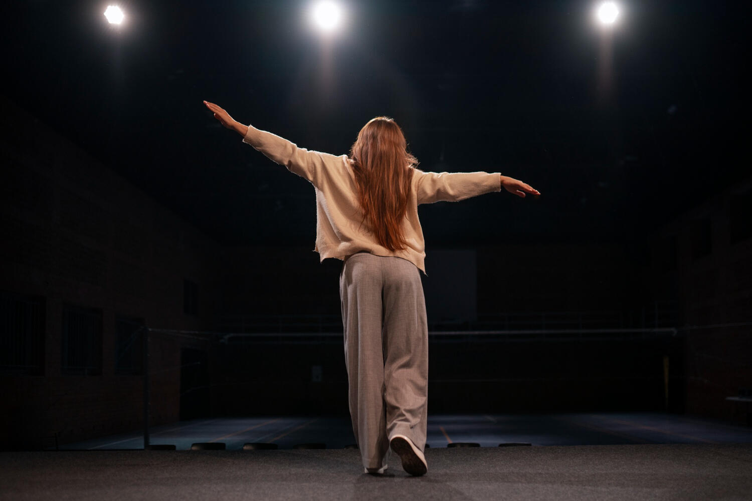 an actress giving her audition with conviction, gesturing largely