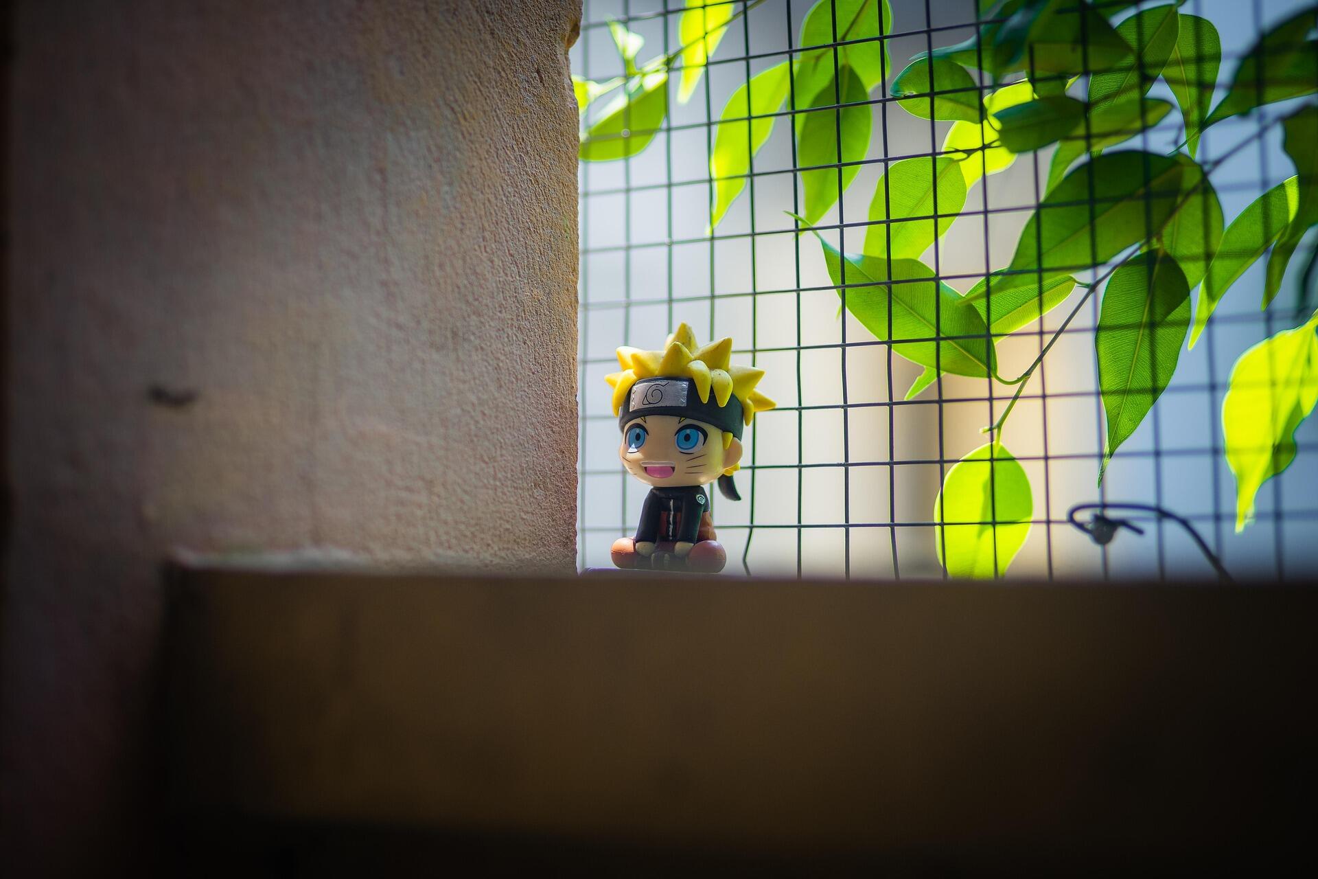Naruto Chibi figurine on a wall