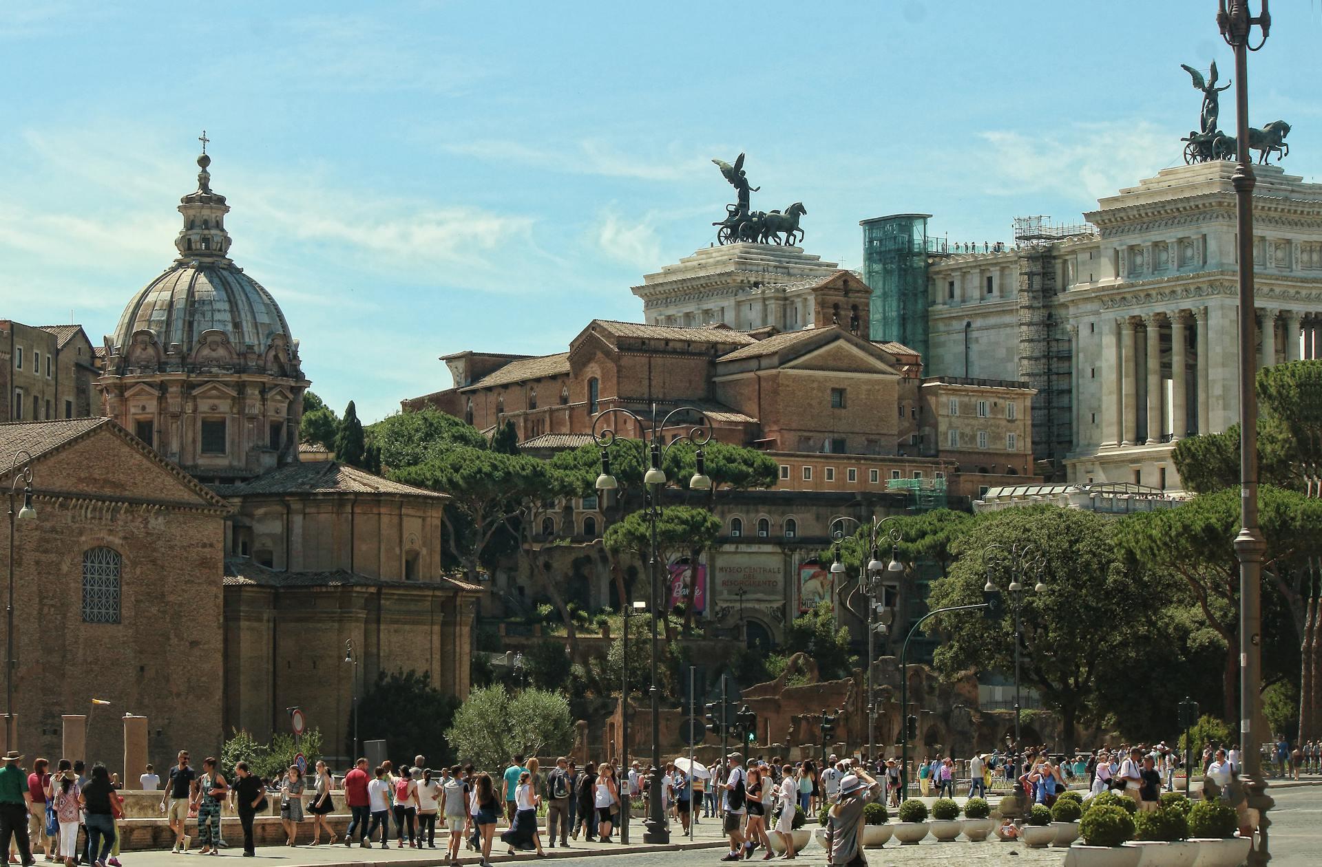 Image of Rome city, modern day, crowds in front of architecture