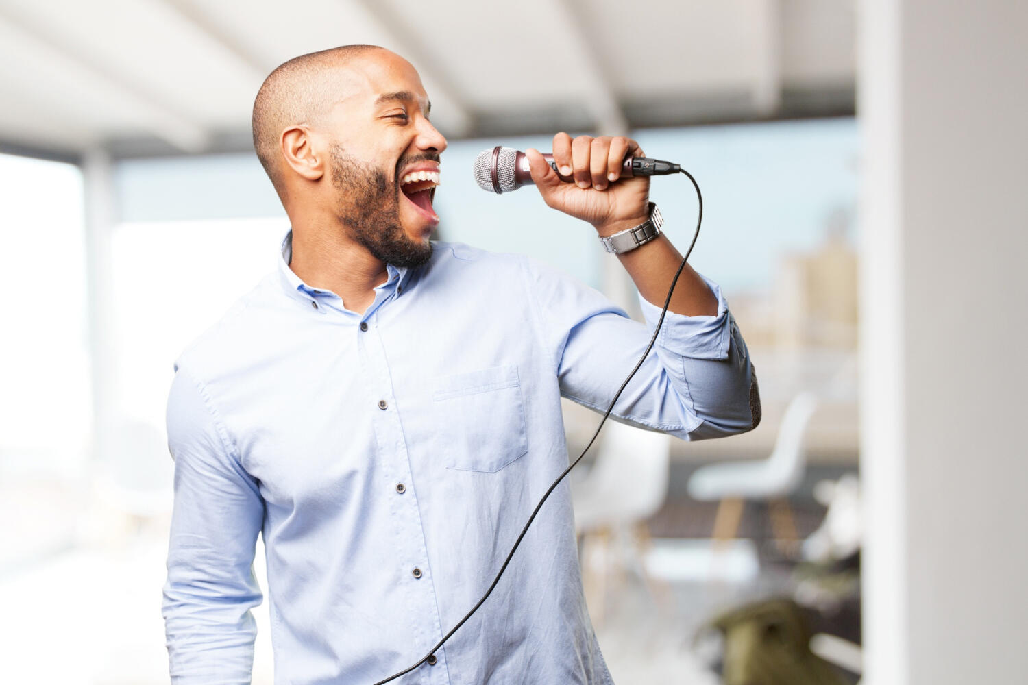a singer using a microphone enthusiastically