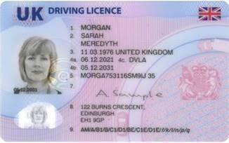Image of a UK driving licence showing personal details, photo, and security features with blurred face and sensitive information.