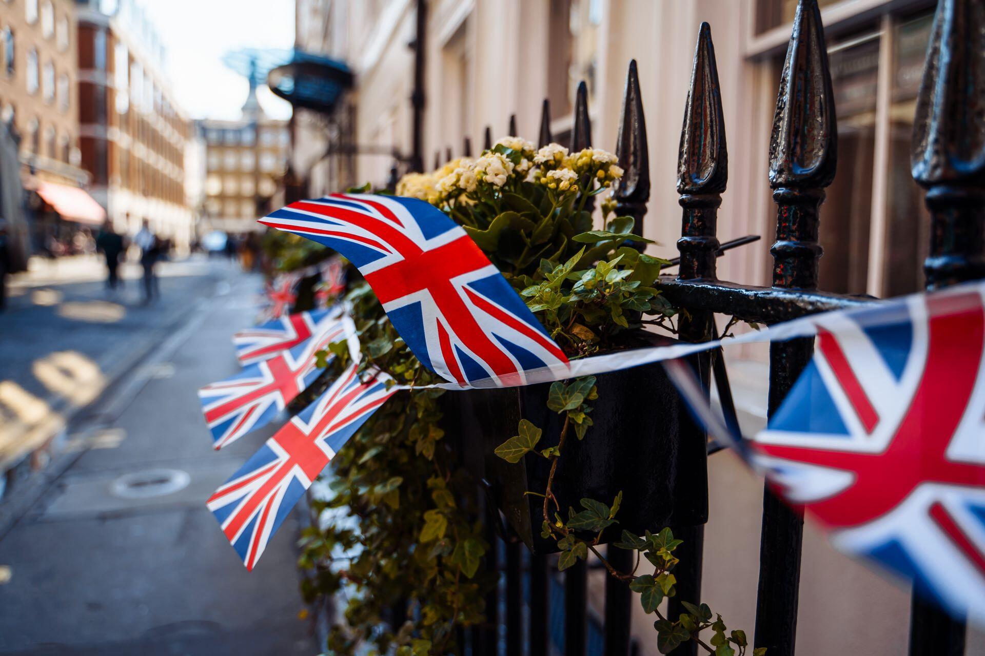 British flags tied to a fence flying in the wind