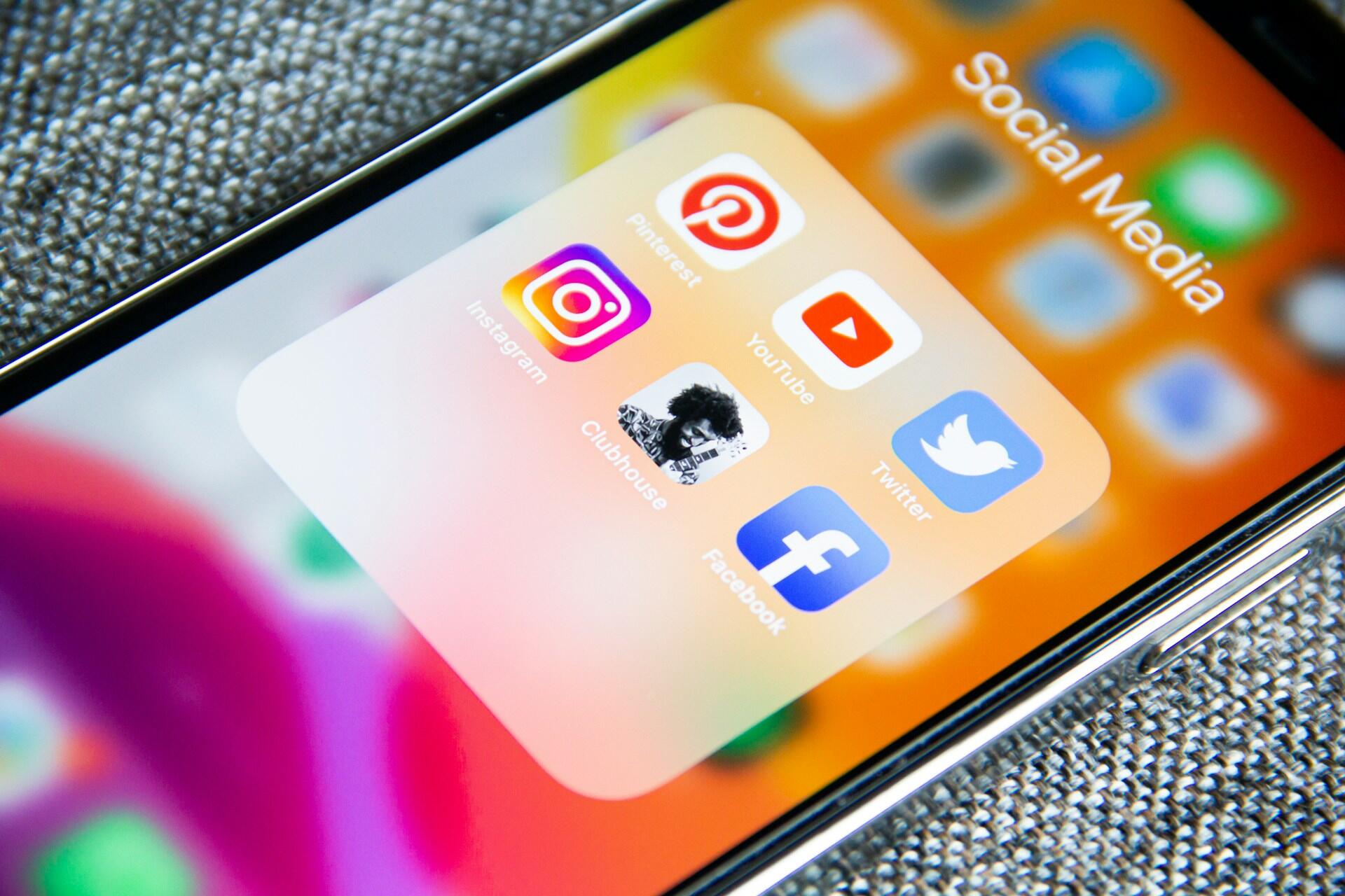 Smartphone screen showing social media app icons for digital marketing channels