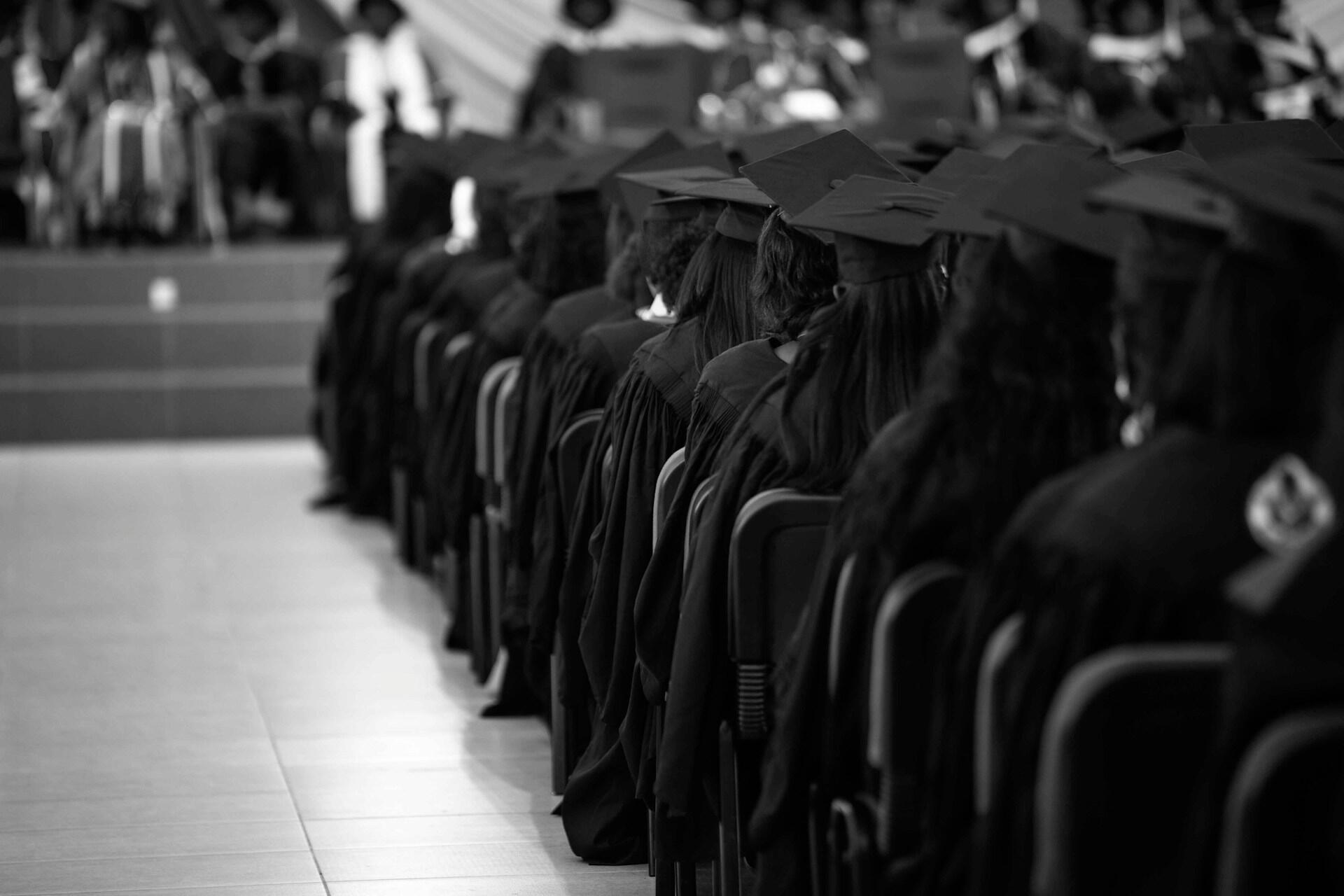 Graduates seated in rows during a graduation ceremony