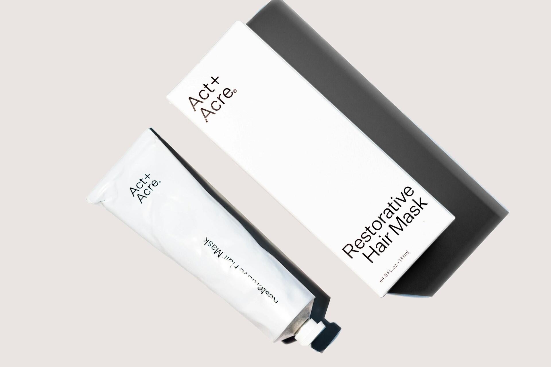 Minimal white hair mask packaging with black typography and matching tube
