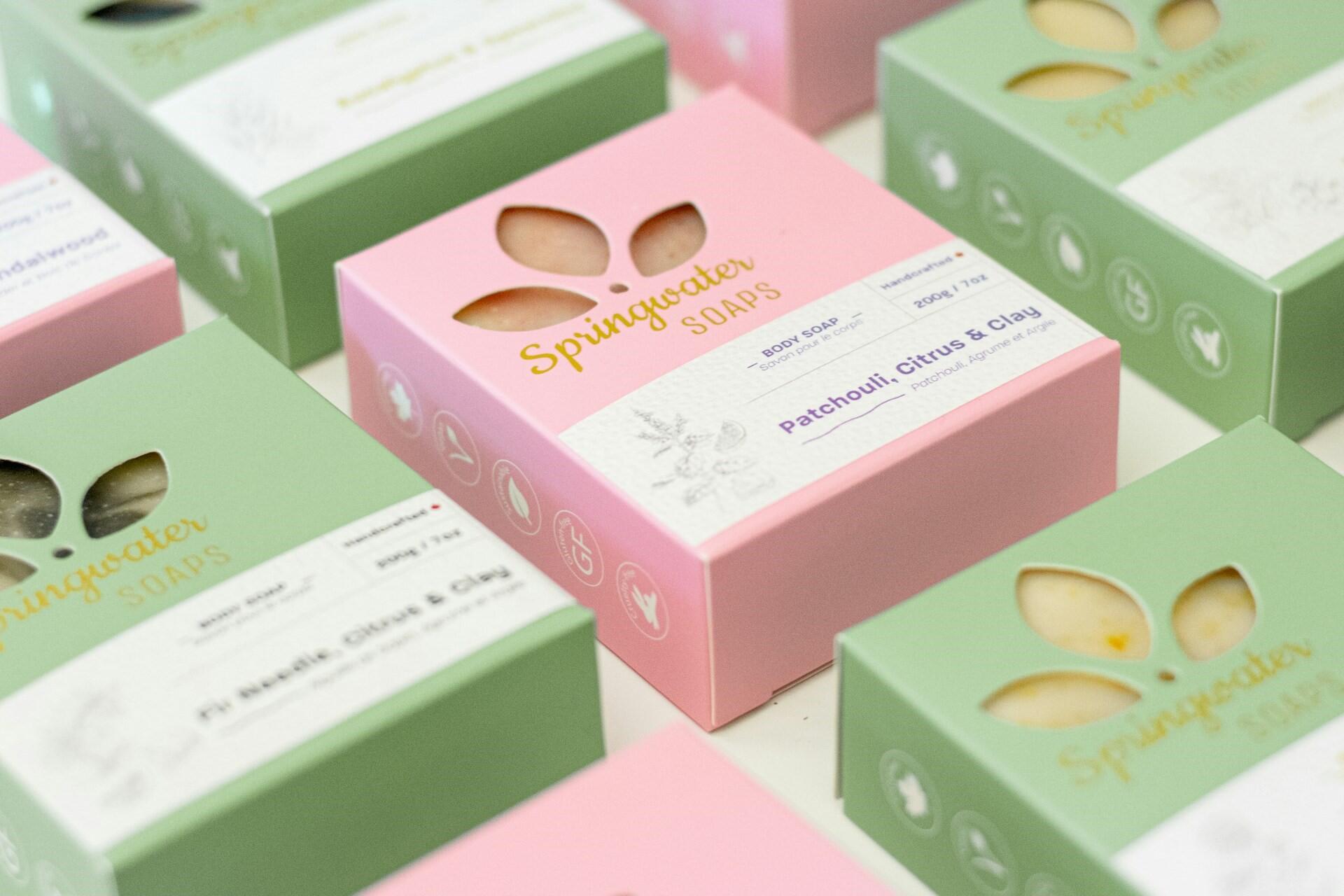 Pastel soap boxes with cut-out details and printed product labels
