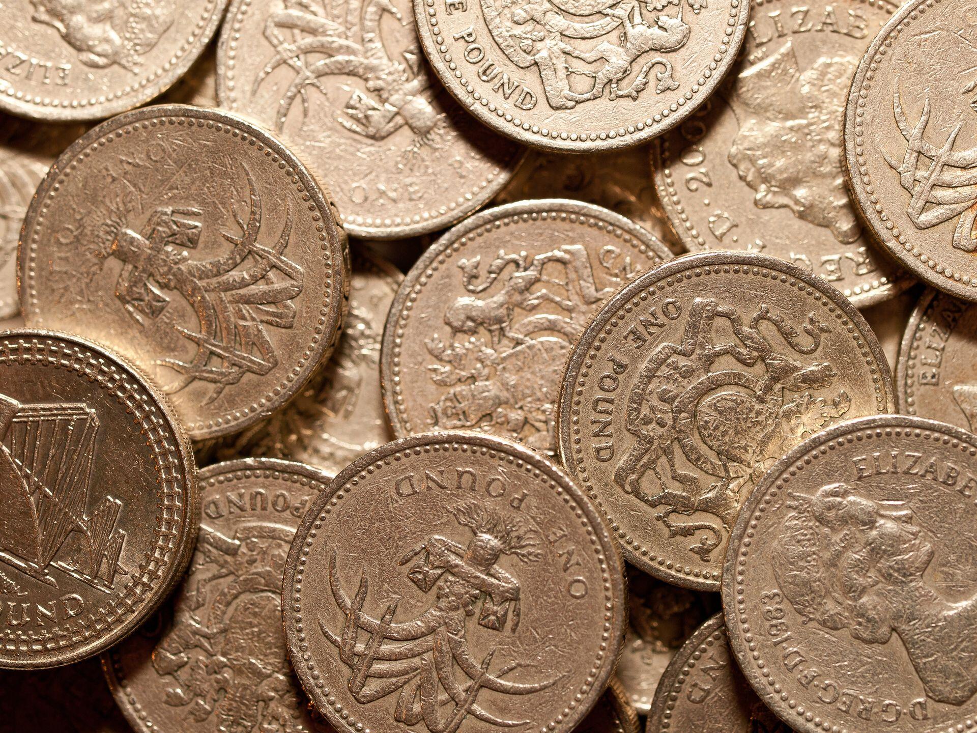 1 pound coins stacked upon each other