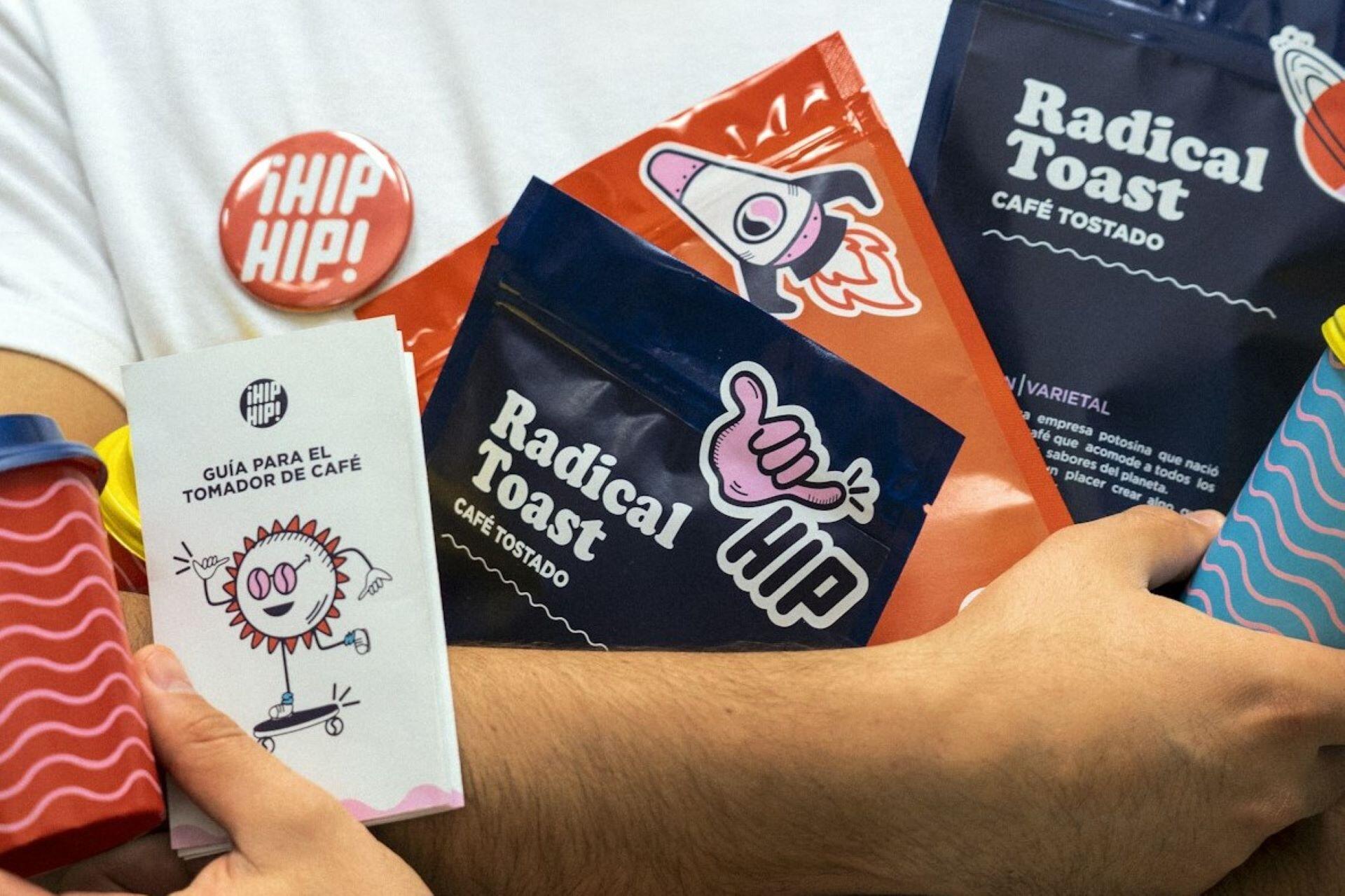 Branded coffee packaging, stickers and printed materials arranged on a table