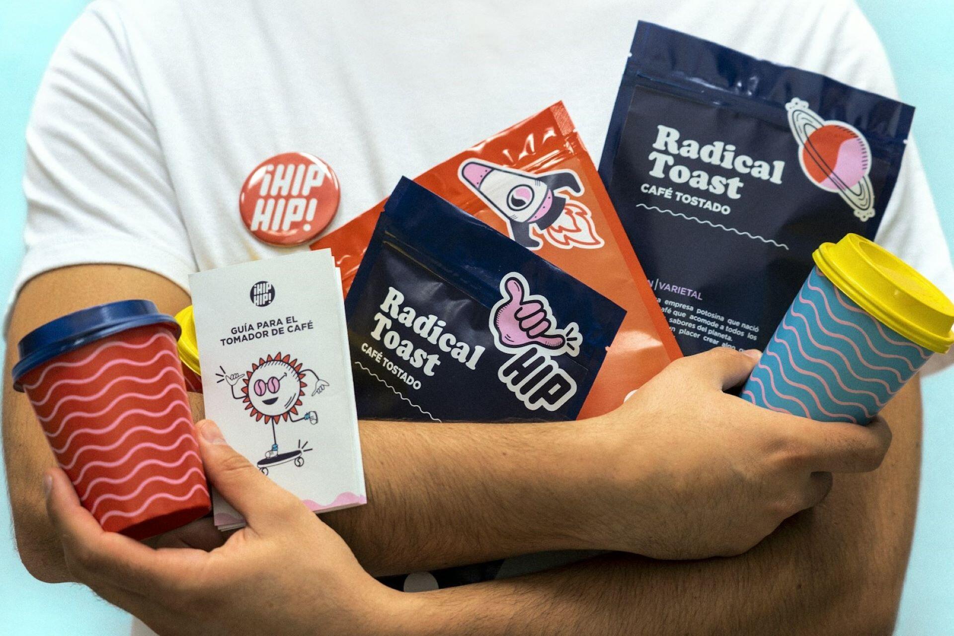 Coffee packaging, cups, stickers, and printed brand materials arranged together