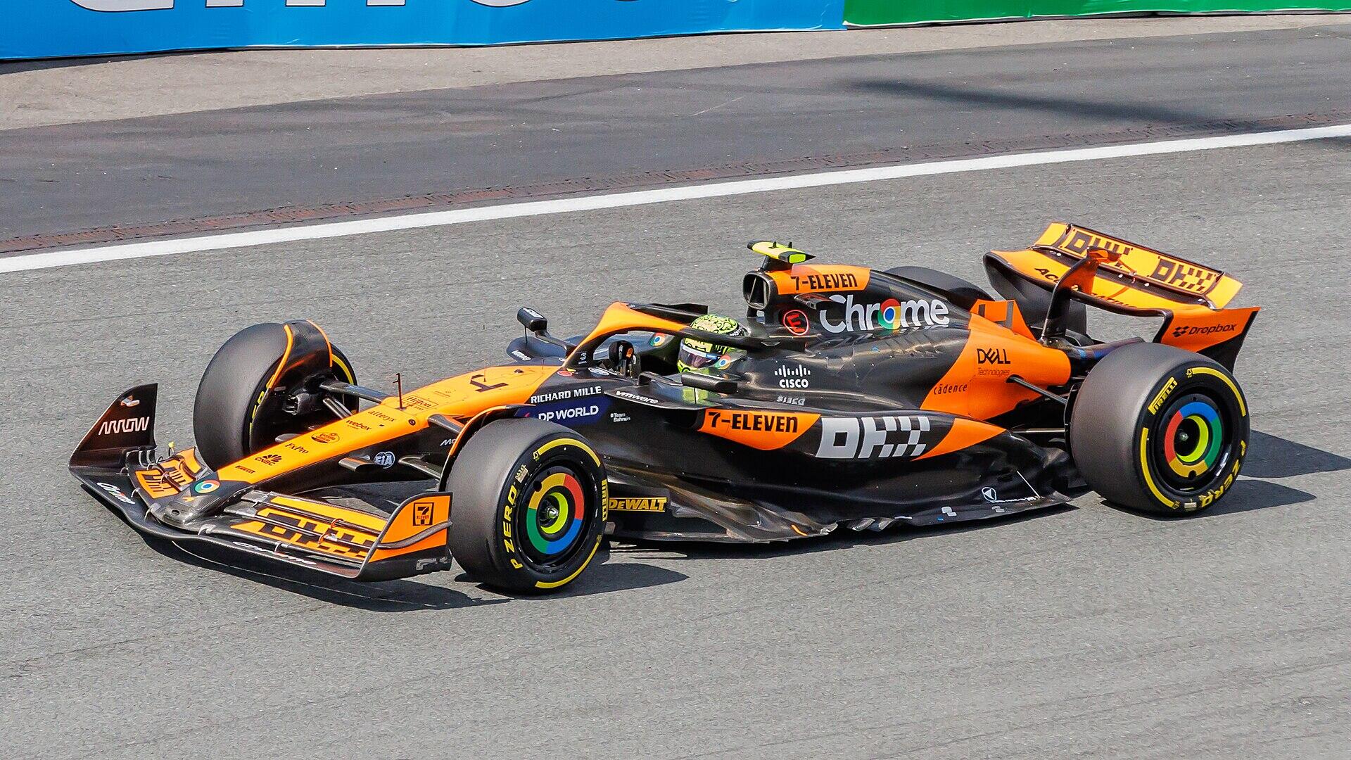 orange racing car on a racetrack