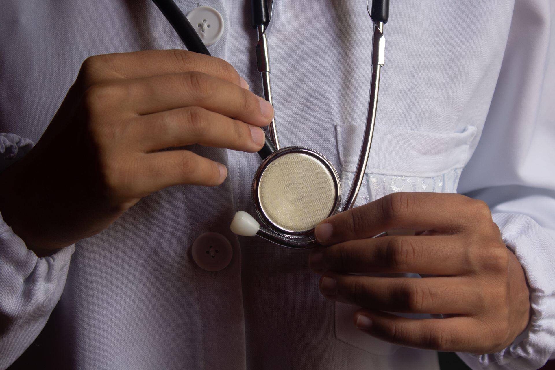 Close up image of doctor holding medical instrument