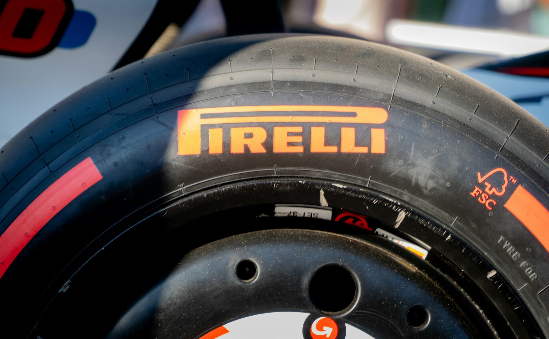 Close-up of a racing car tire featuring the brand name