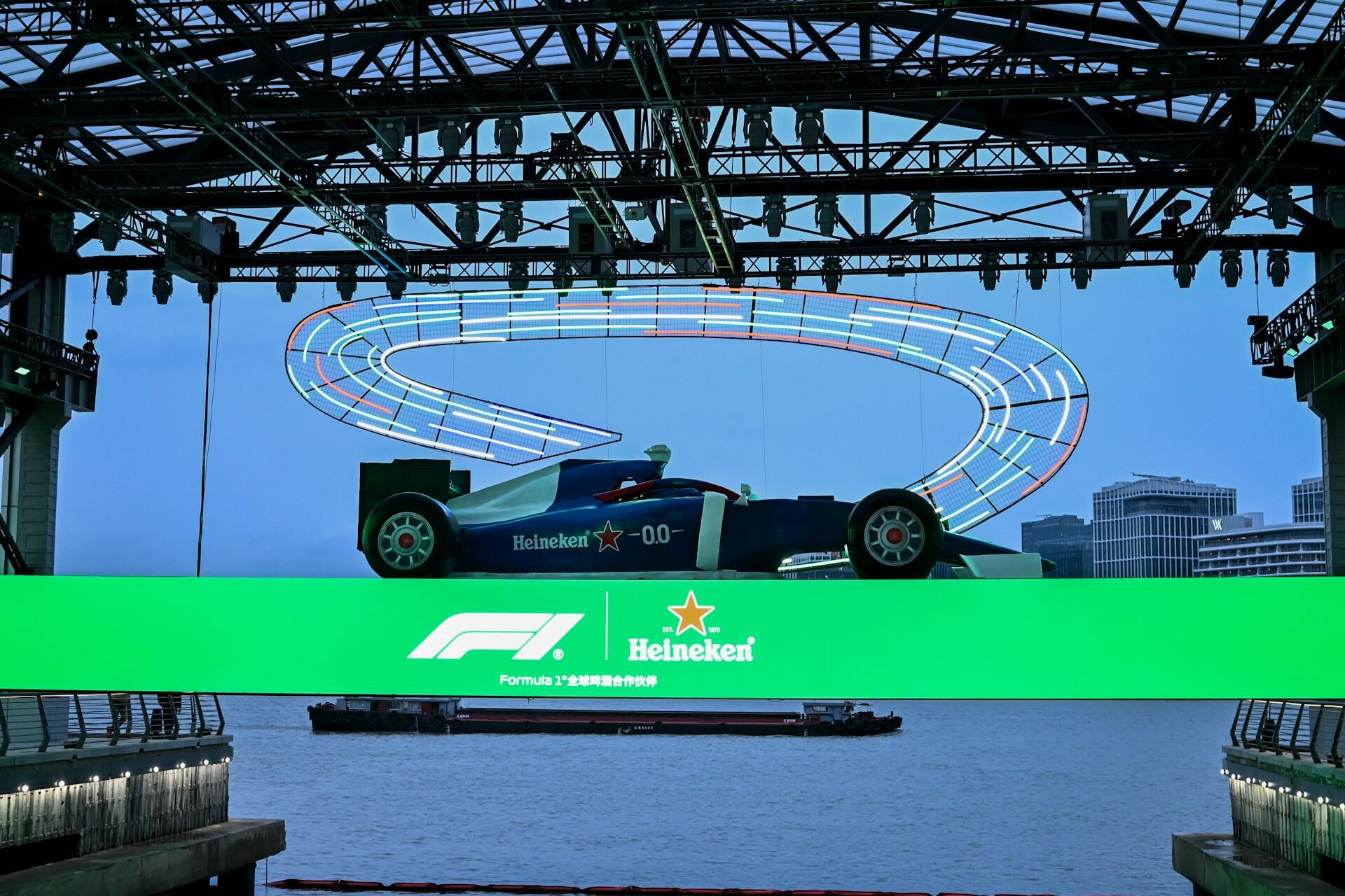 A green screen background featuring a car positioned prominently in the center.