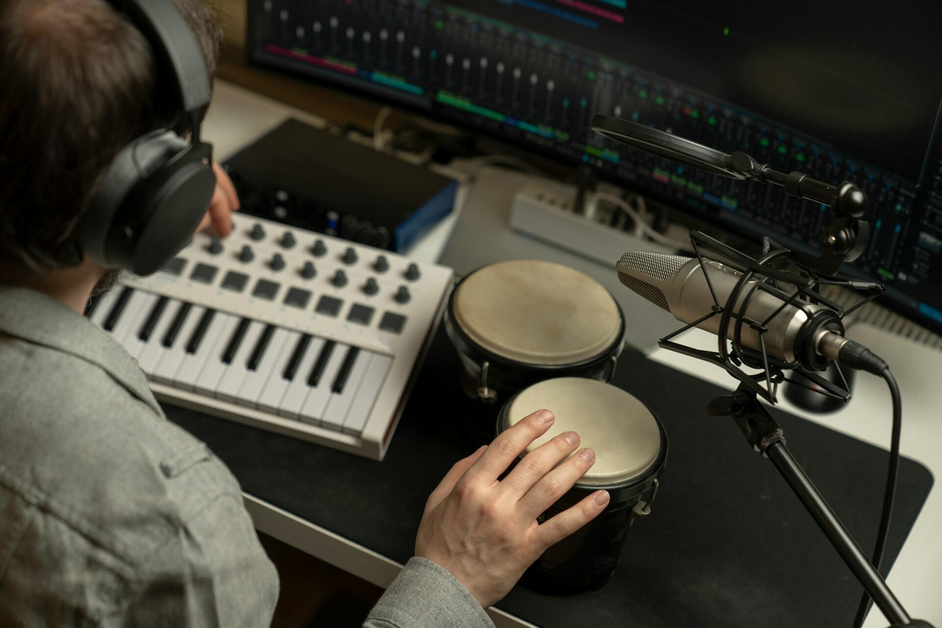sound designer adding sound effects to a track using musical instruments