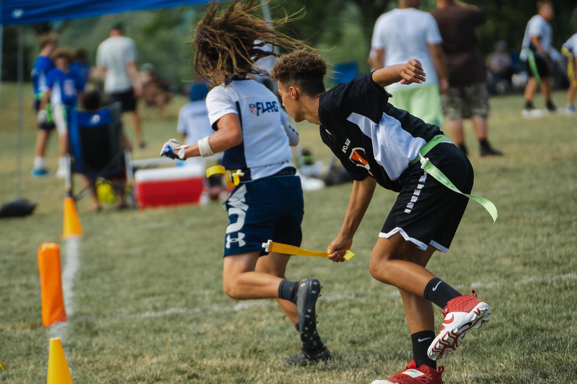 Player pulling flag during a flag football game.