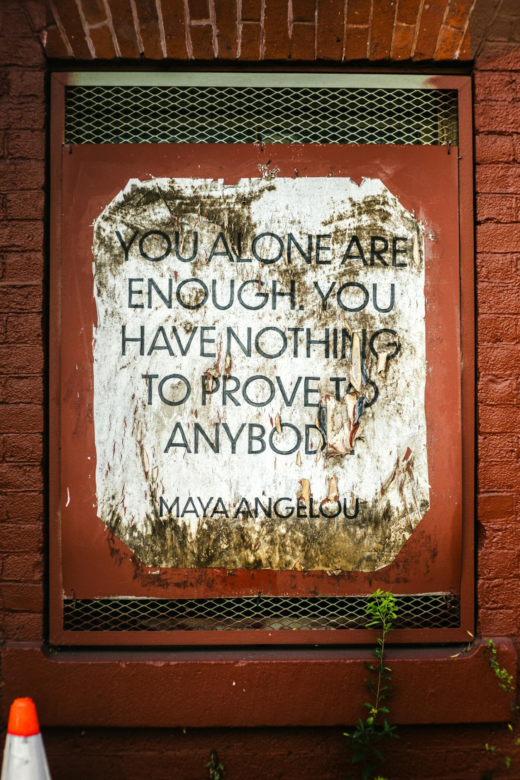 maya angelou quote ' you alone are enough, you have nothing to prove to anybody' written on a wall.