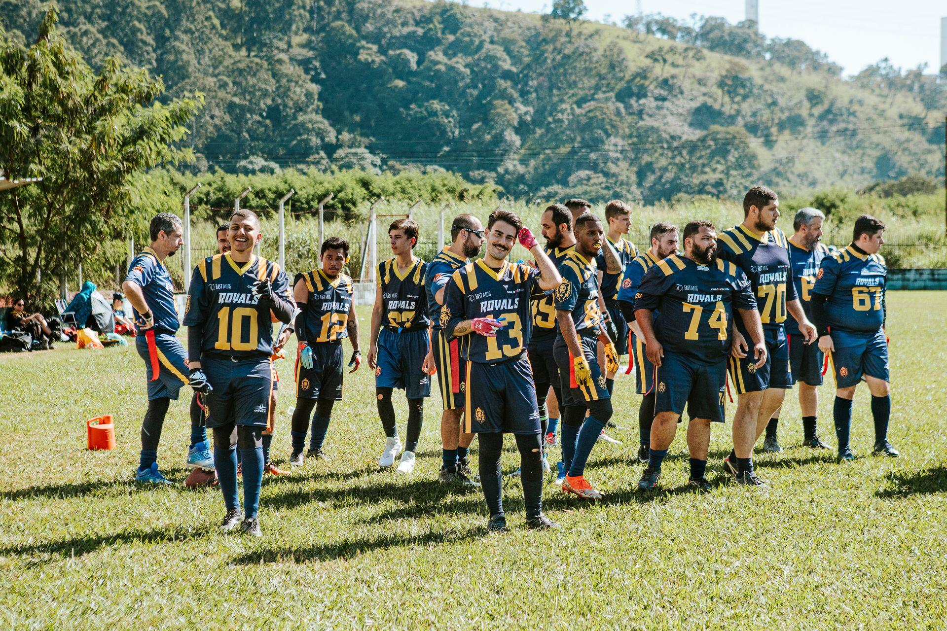 A photo of a men's flag football team on a court.
