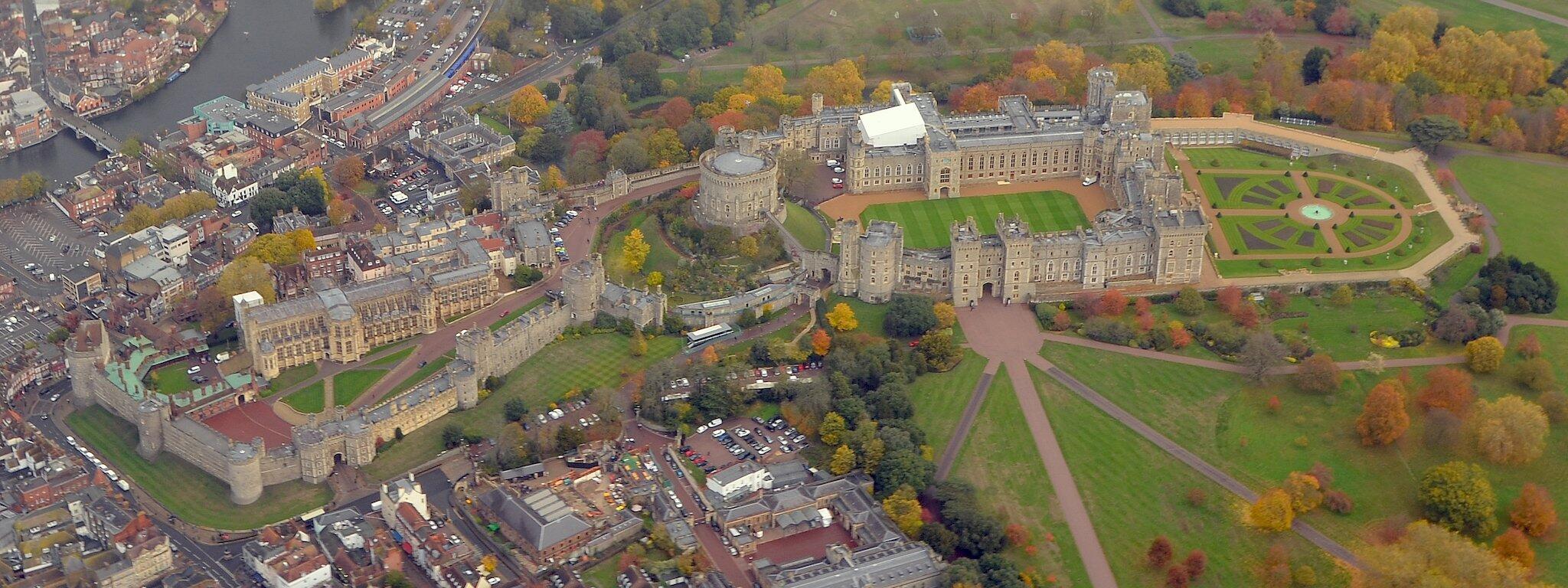 An aerial view of Windsor Castle that shows its full layout and the greenery around it.