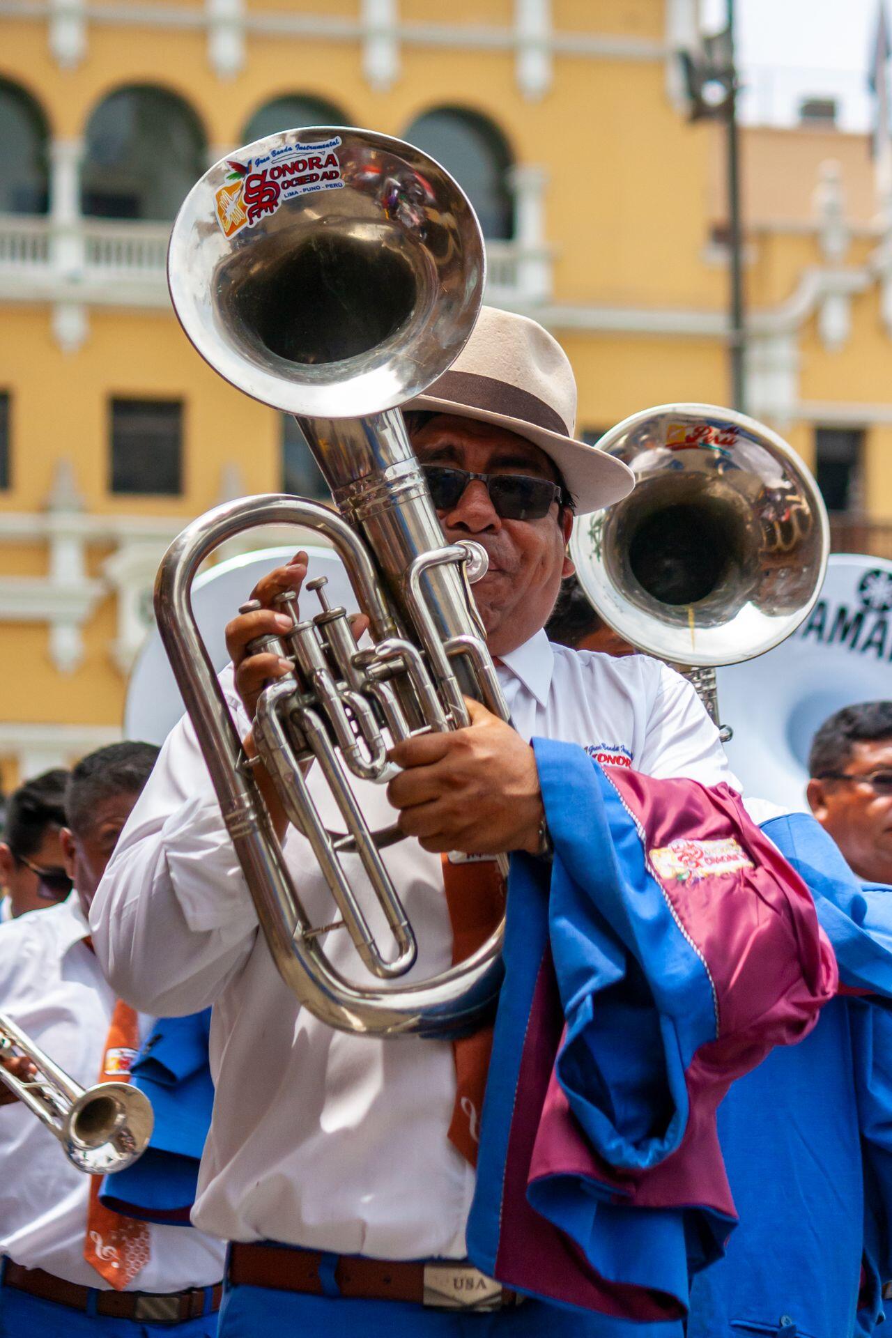 a marching player with a tenor horn or euphonium