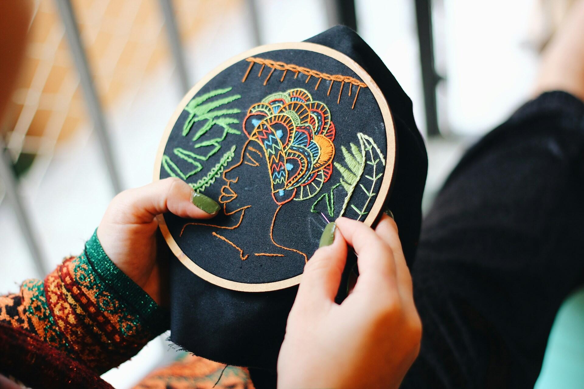 An embroidery of a woman's face.