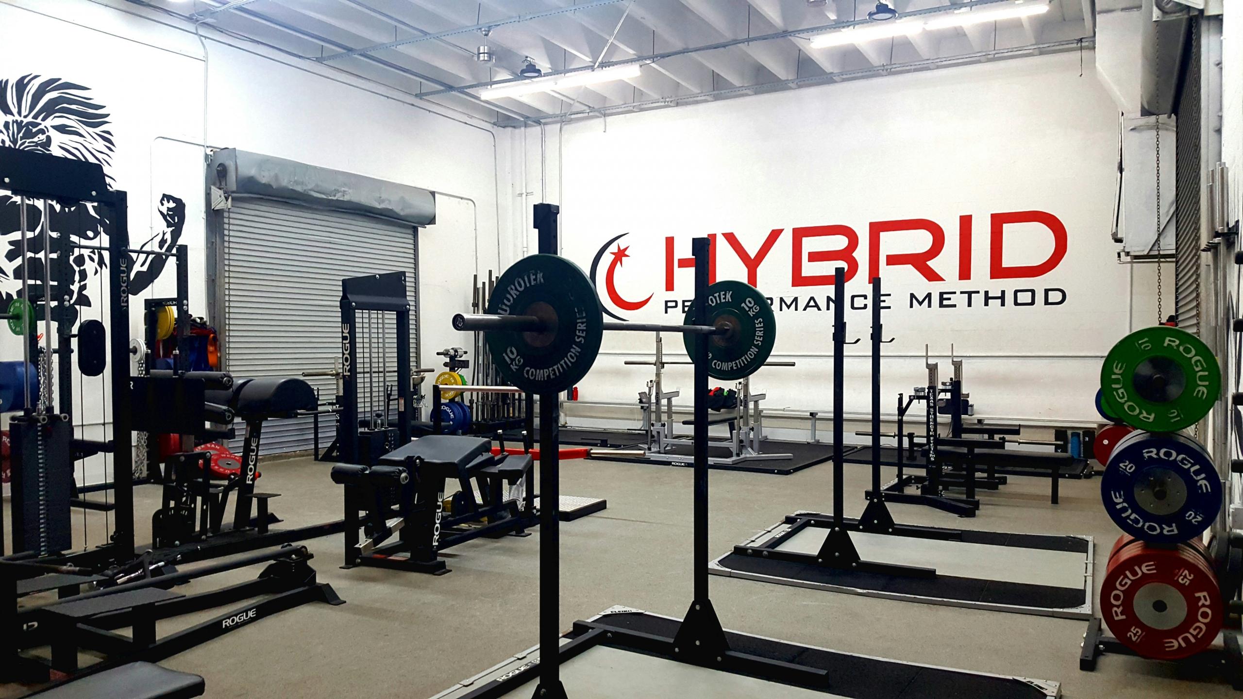 A gym full of weights and other pieces of equipment