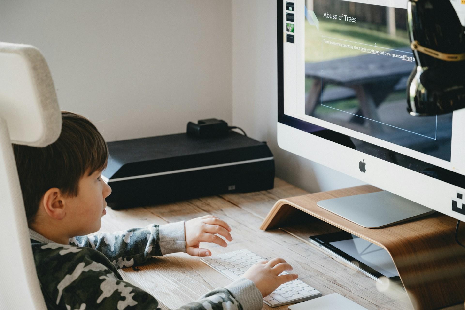 A child studying on a computer.