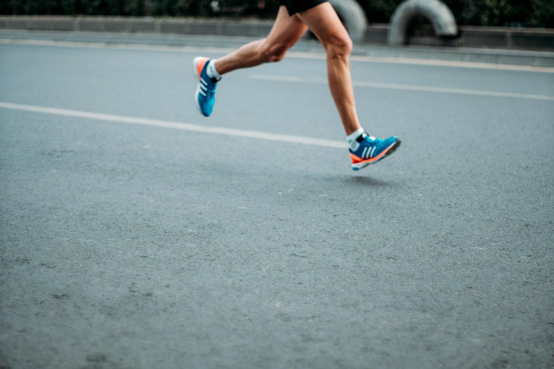 A person running on a road.
