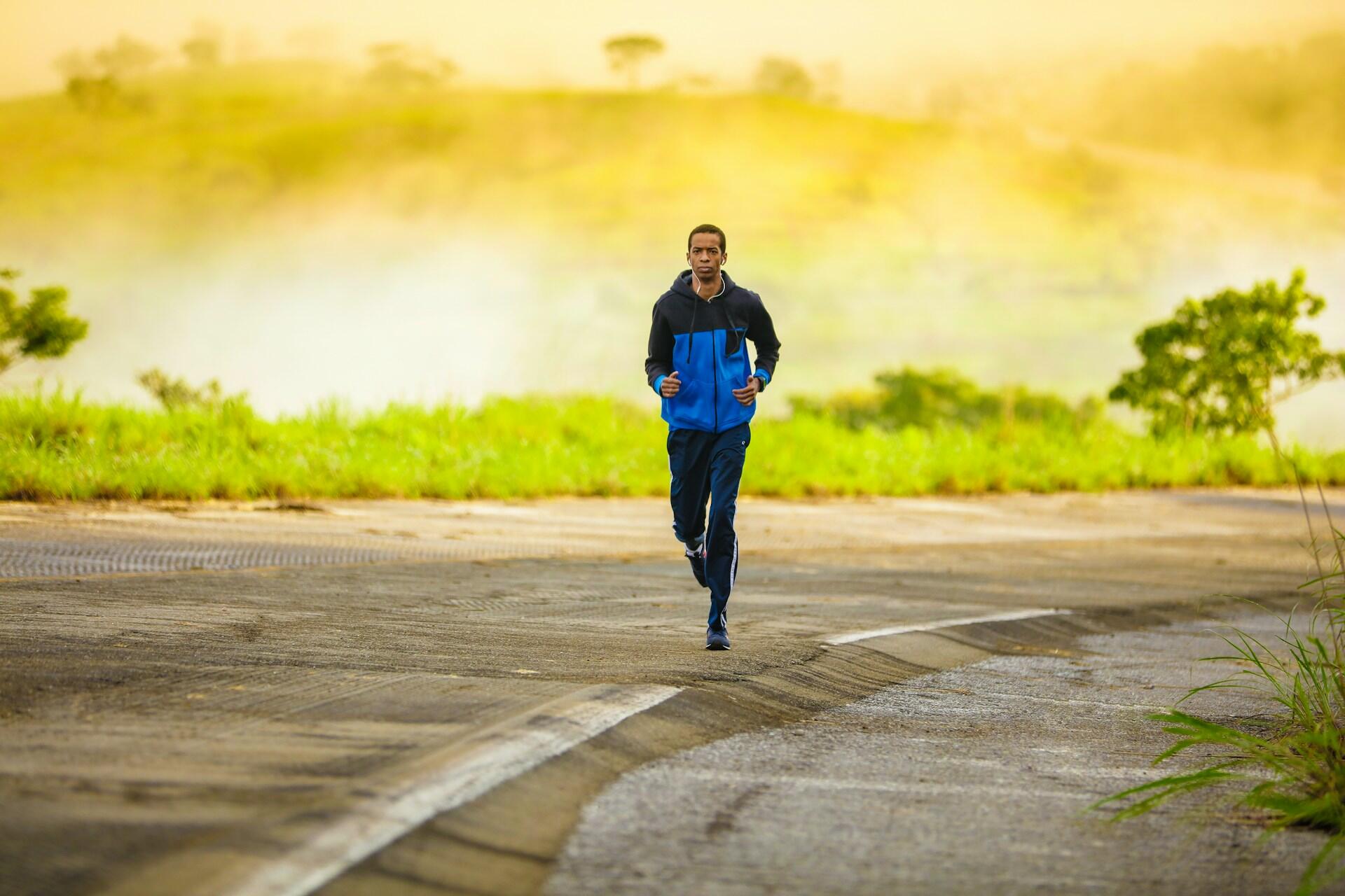 A person running along a road.