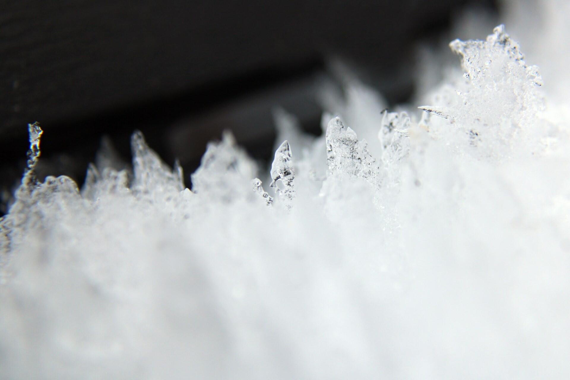 Close-up of clear sugar crystals forming sharp edges