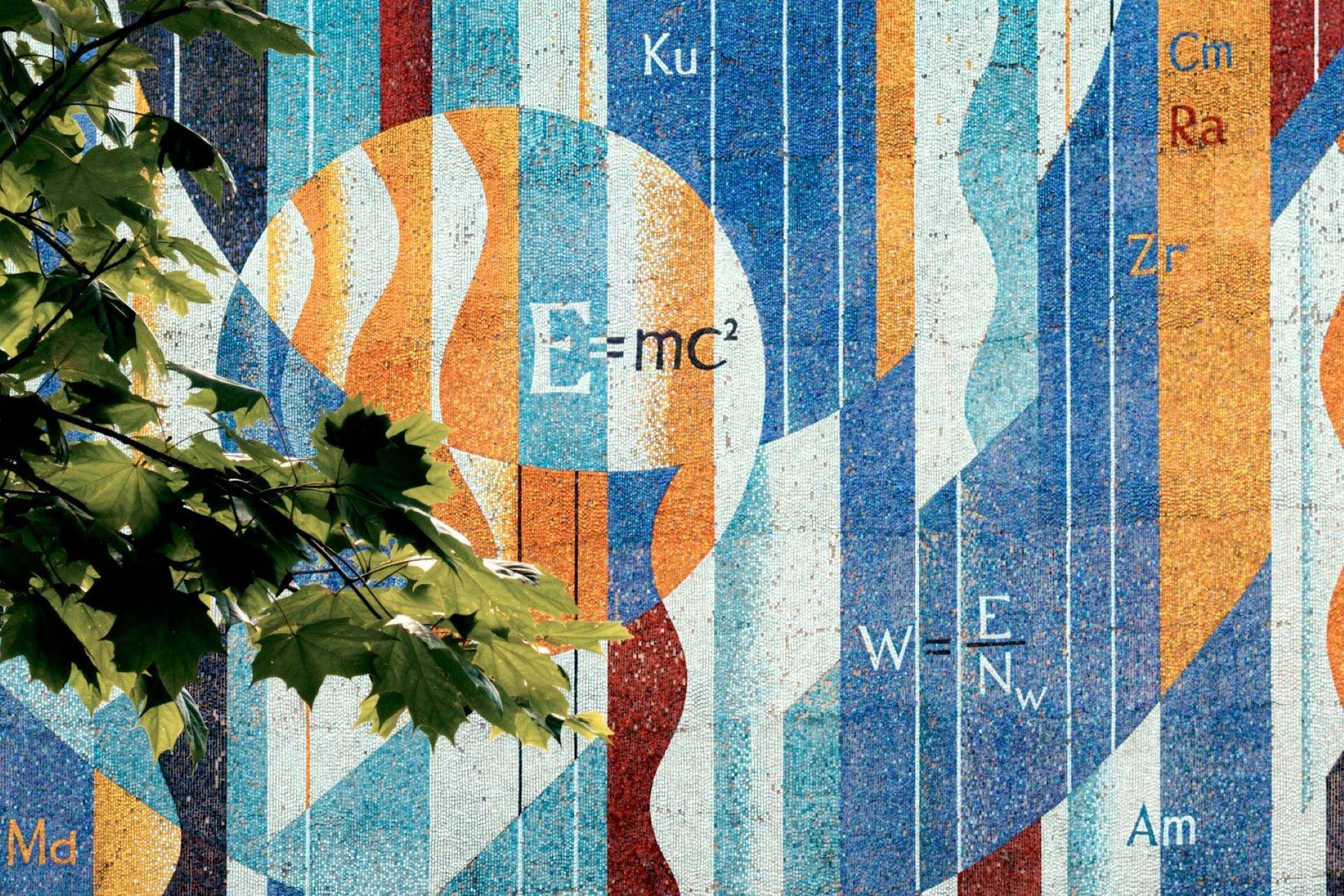 Physics mural showing scientific formulas and symbols