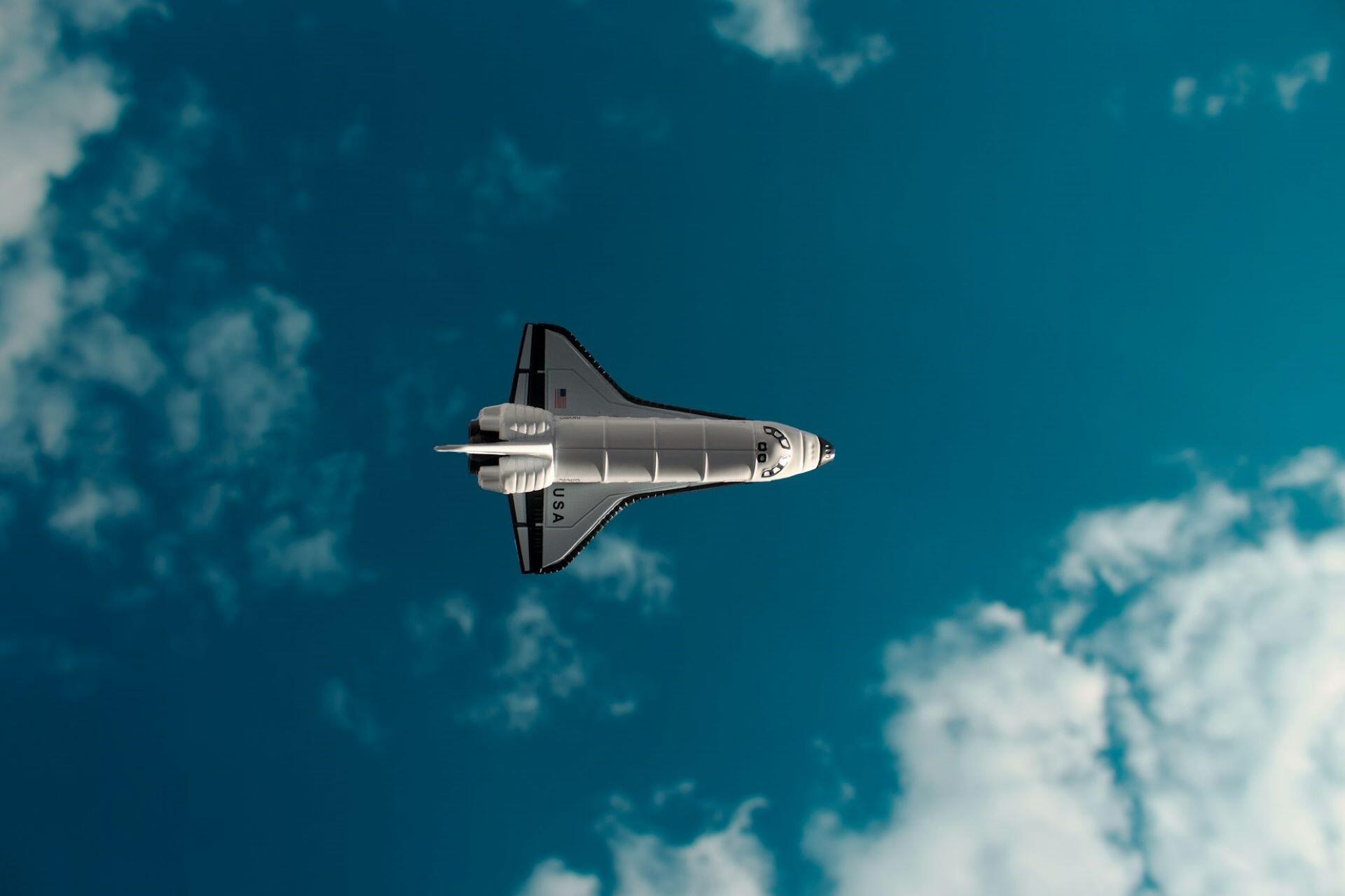Space shuttle flying through the sky