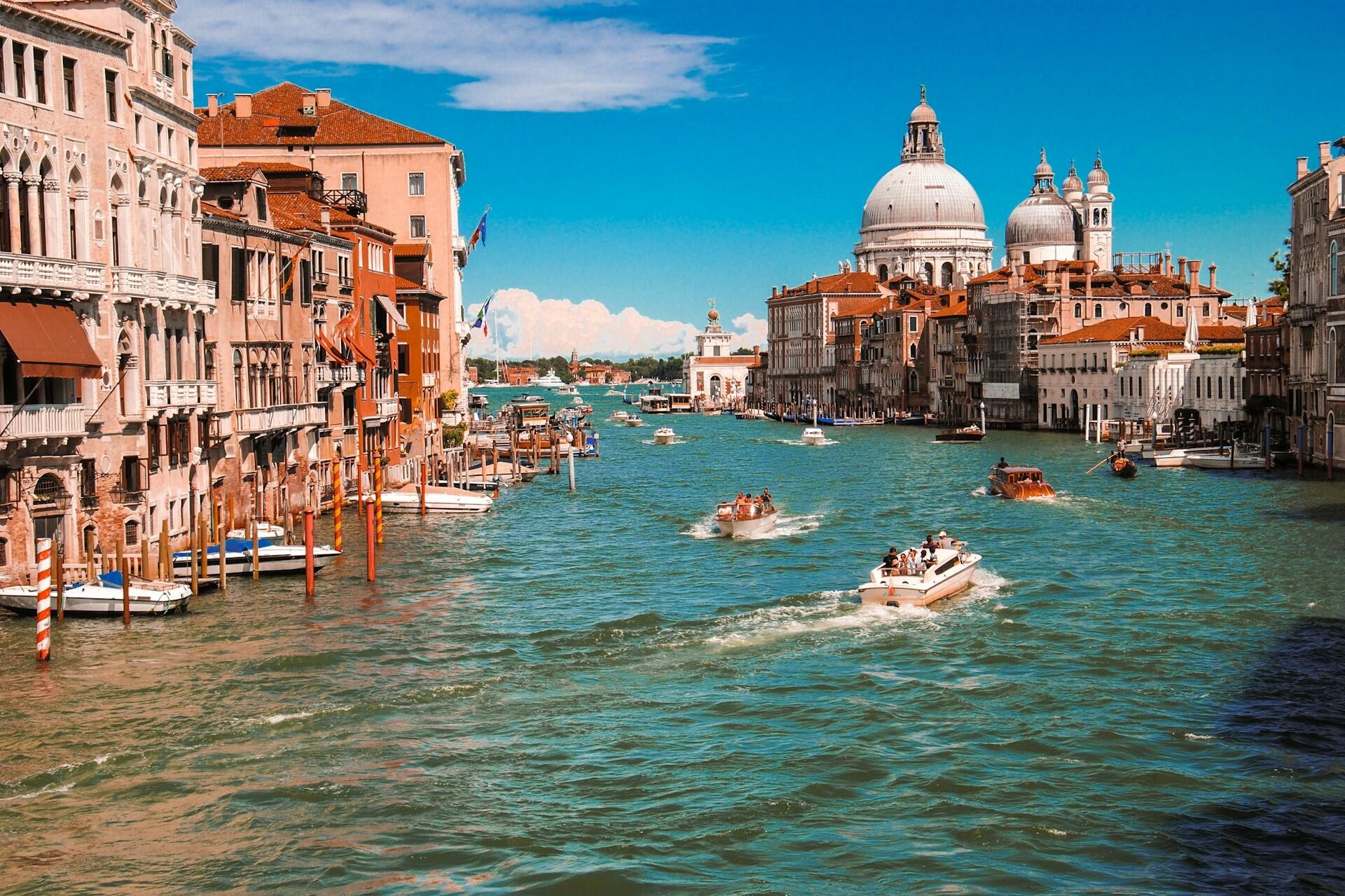 Grand Canal in Venice with boats, historic buildings and Santa Maria della Salute