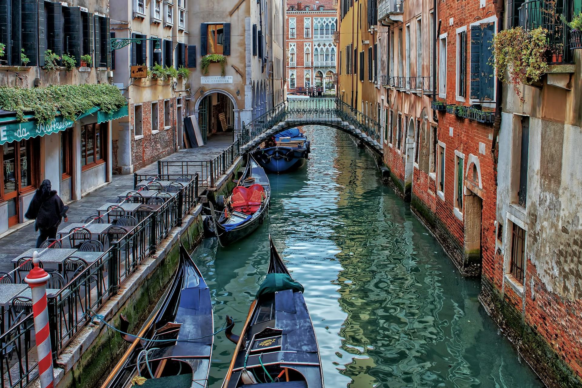 A canal with gondolas in Venice, Italy.