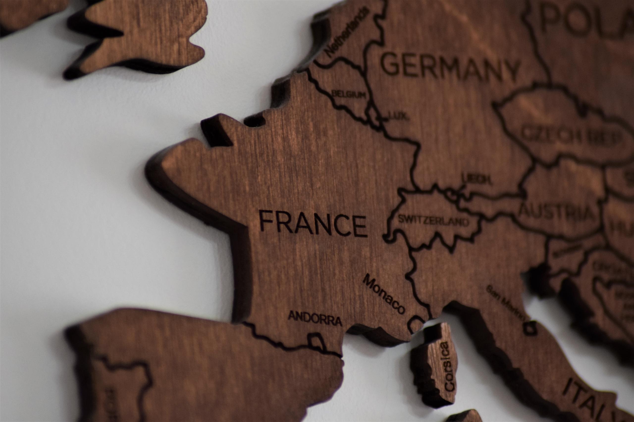 A wooden block showing mainland Europe with France at the centre.