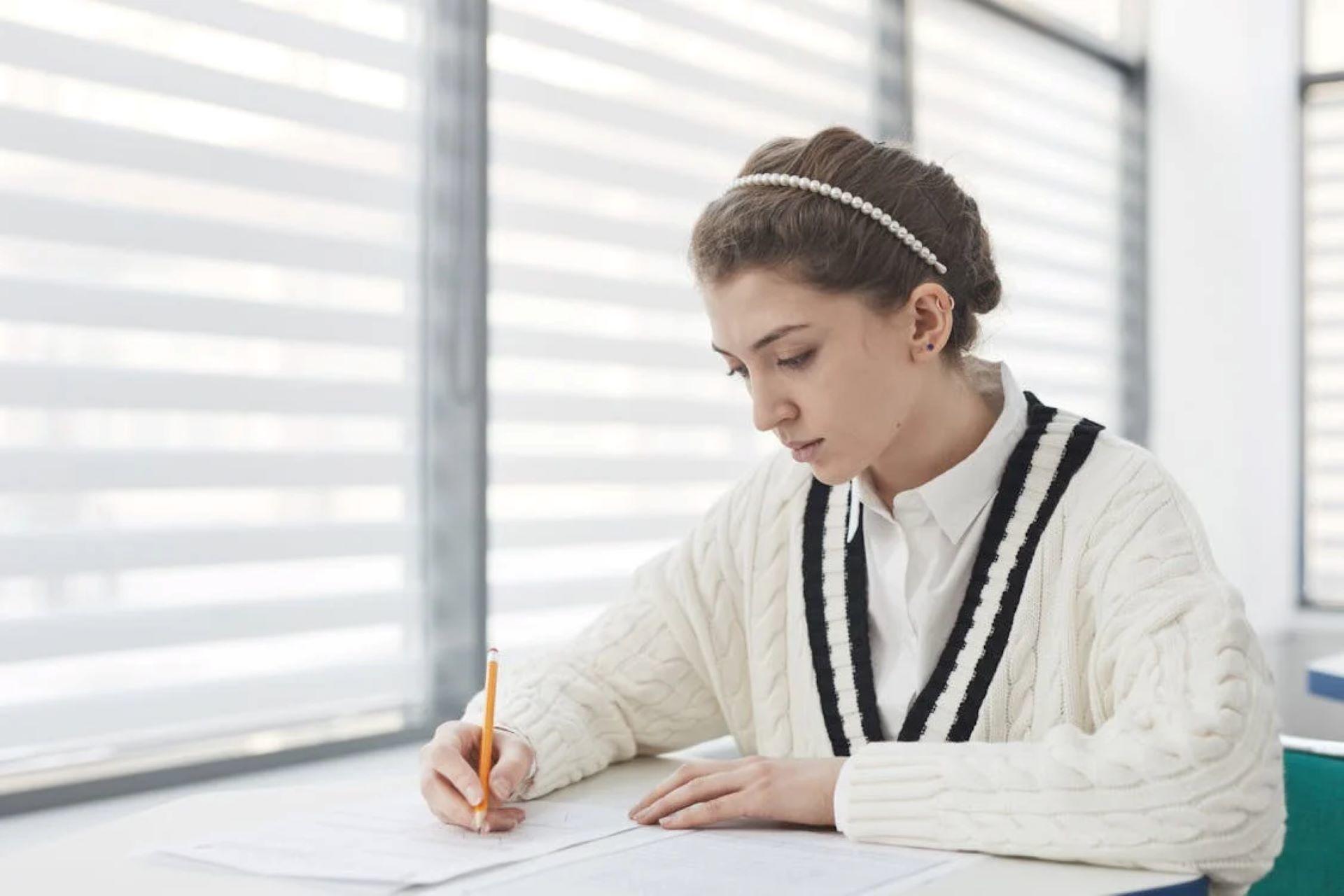 Female student focused on writing