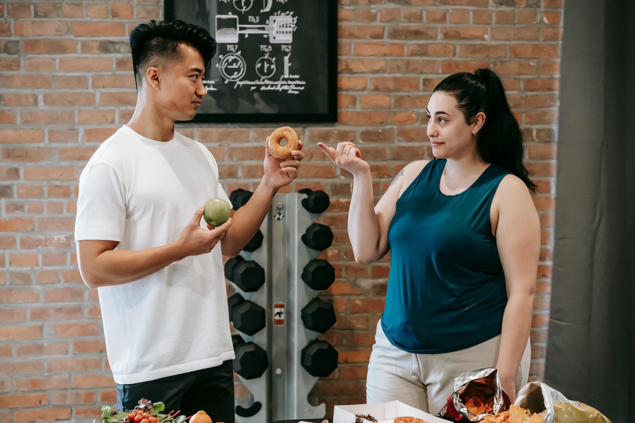 A discussion on food choices taking place at the gym.
