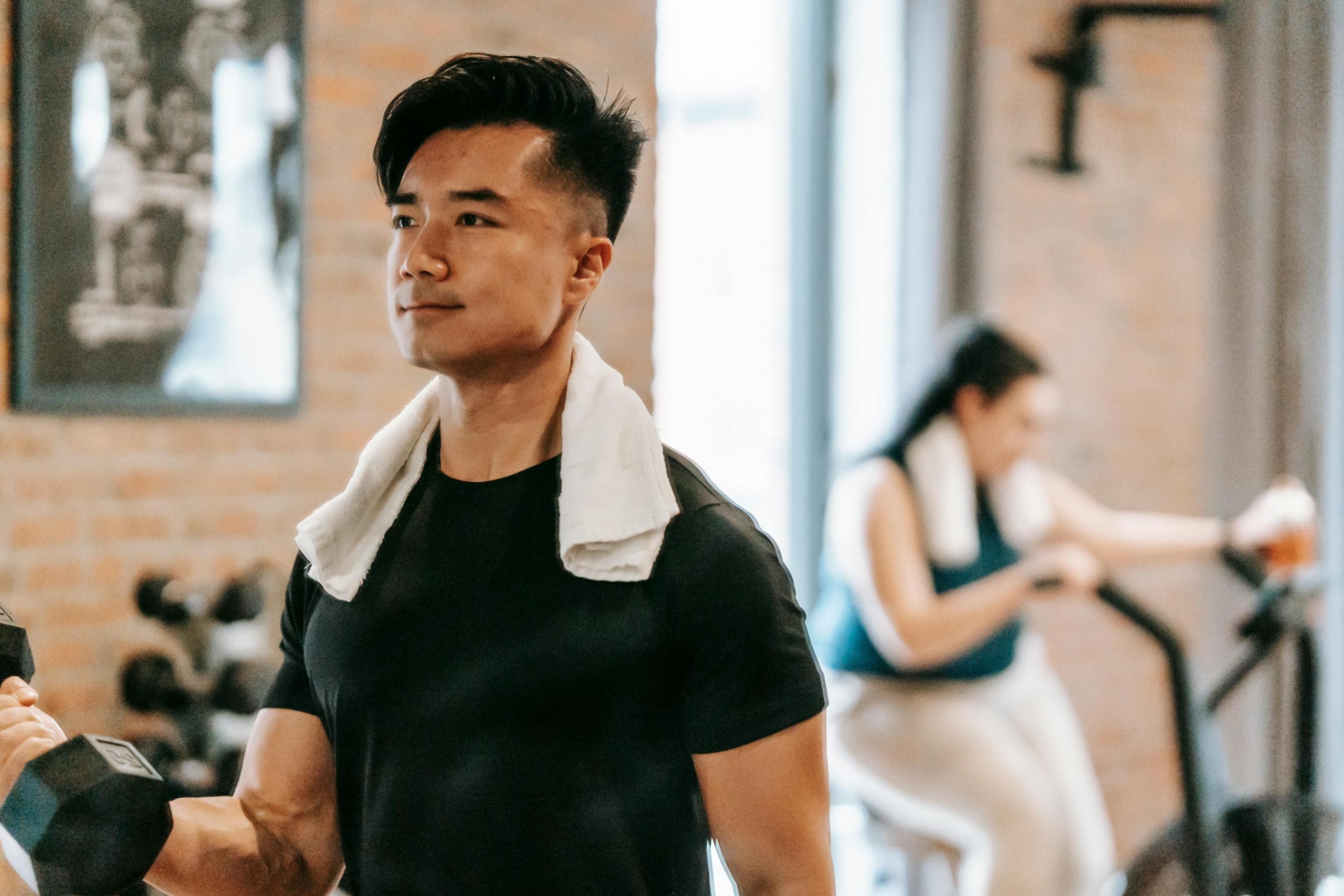 A man focused on gaining weight by incorporating resistance training into his routine.