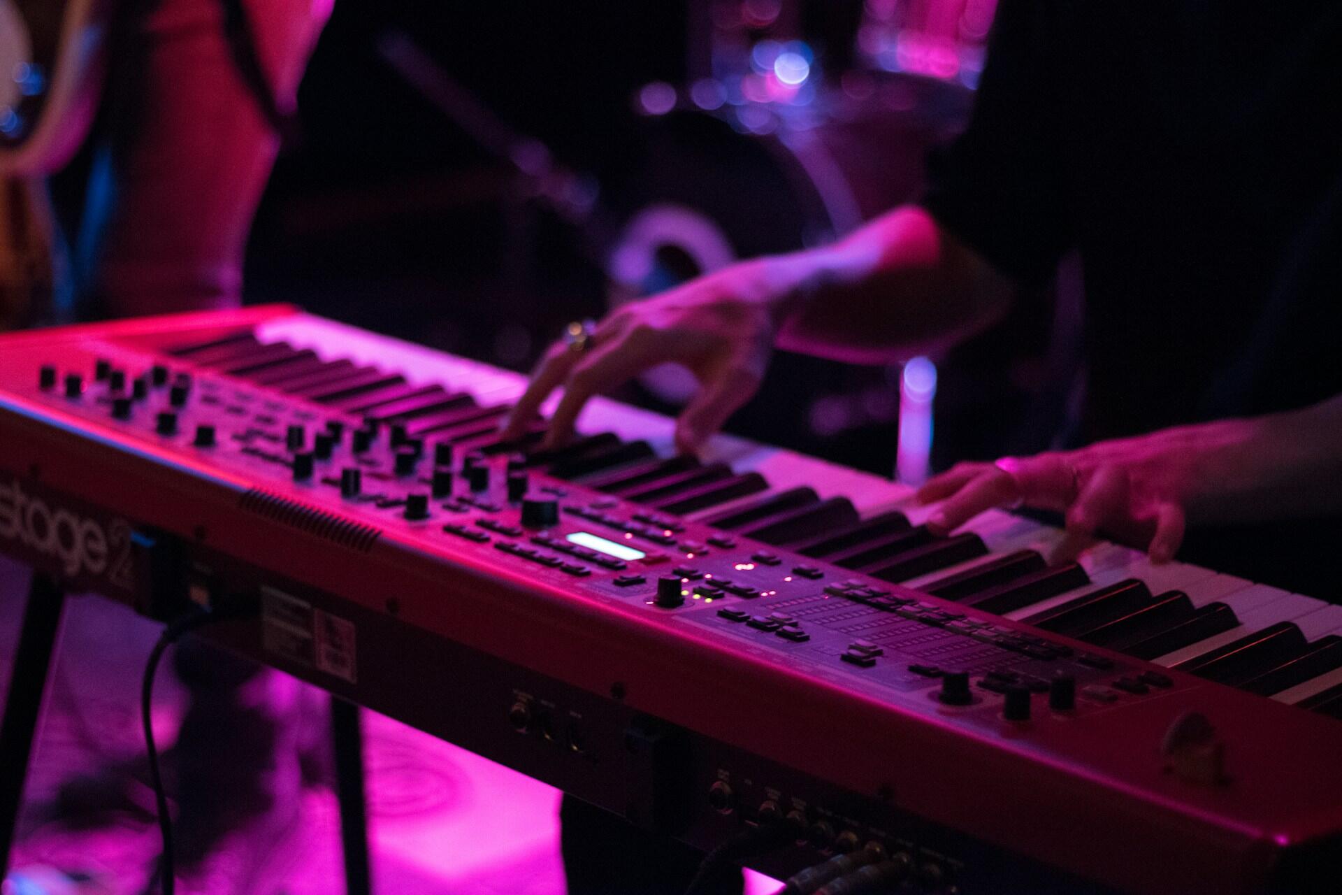 A pianist playing a keyboard.