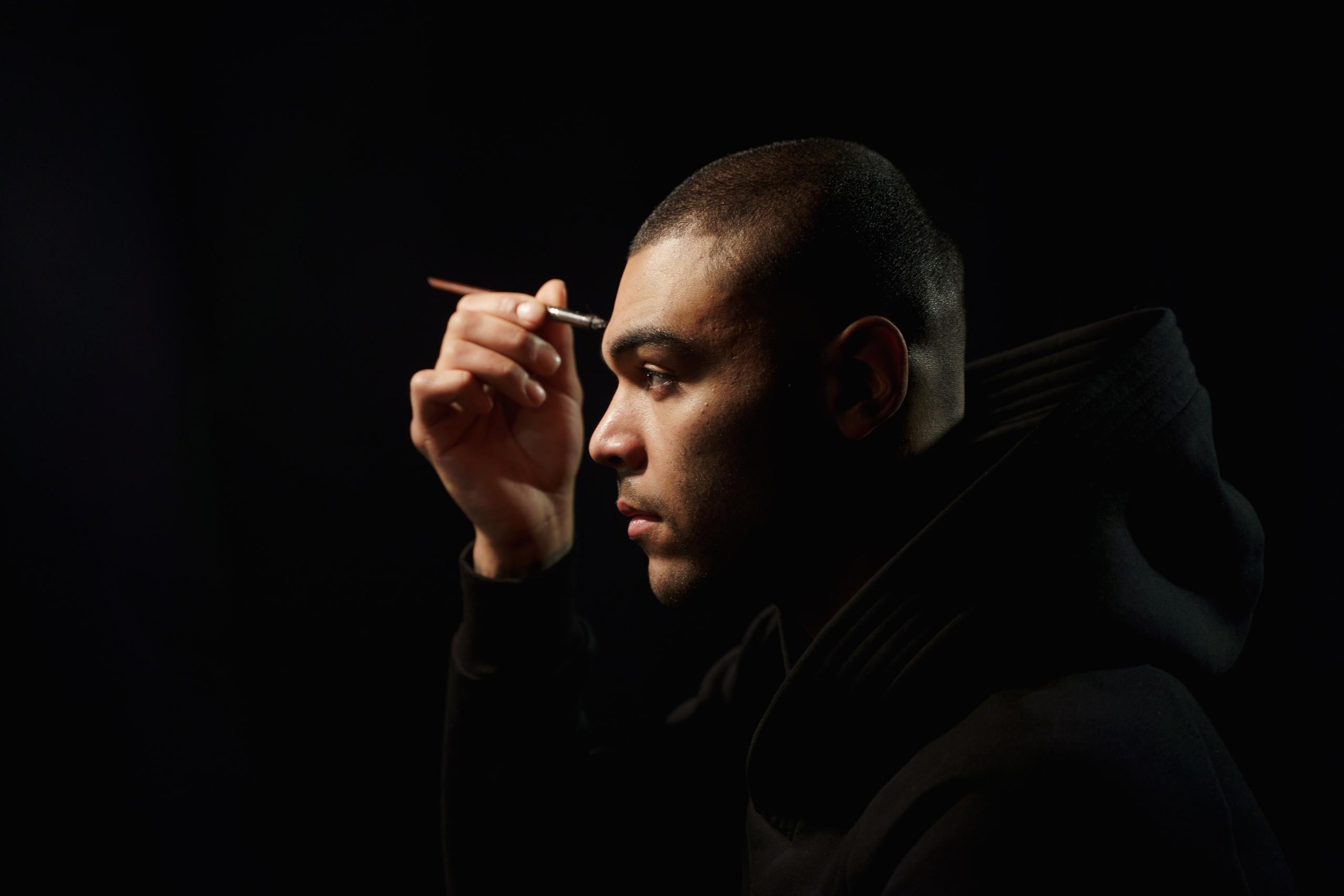 actor applying makeup