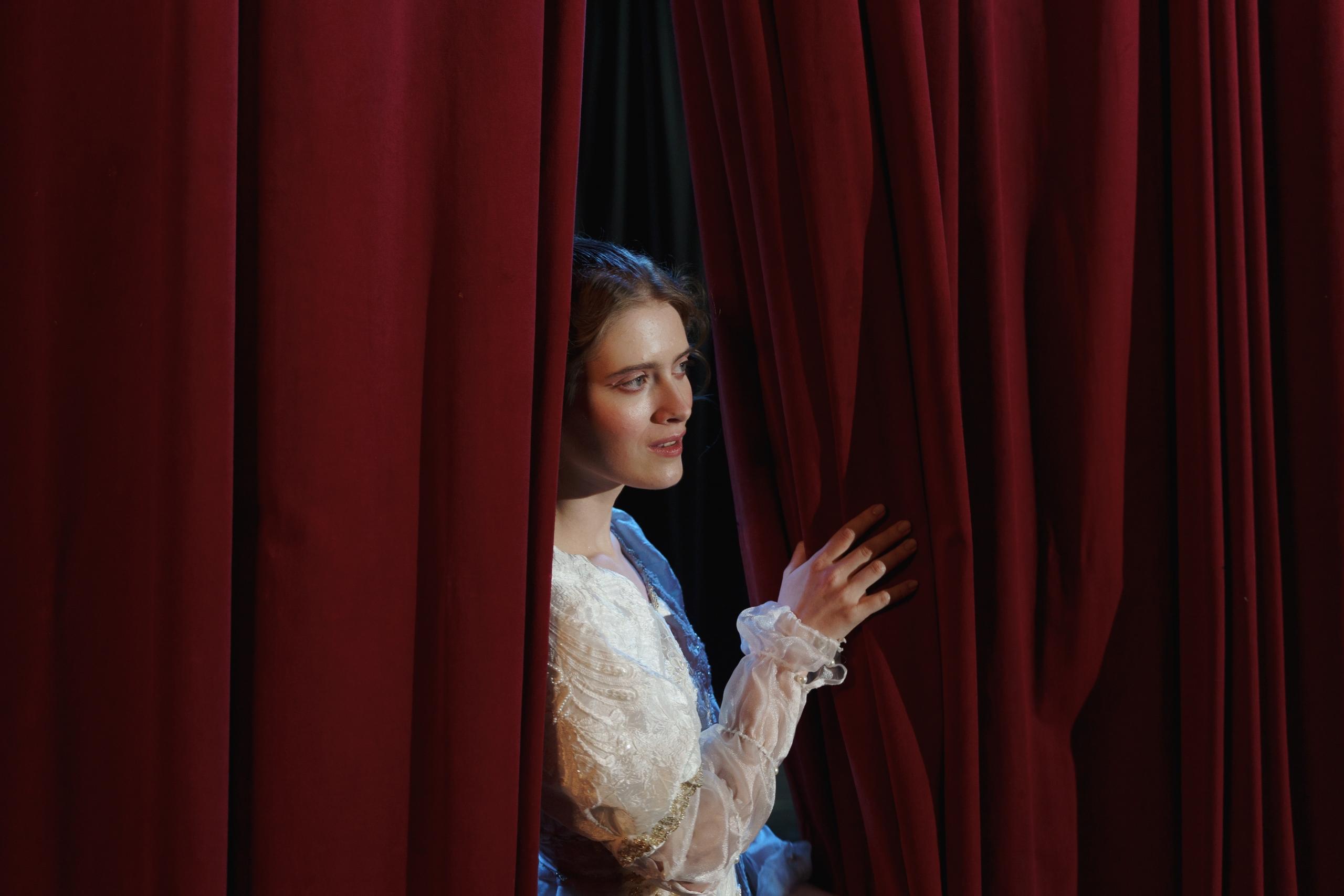 An actor about to come out onto the stage