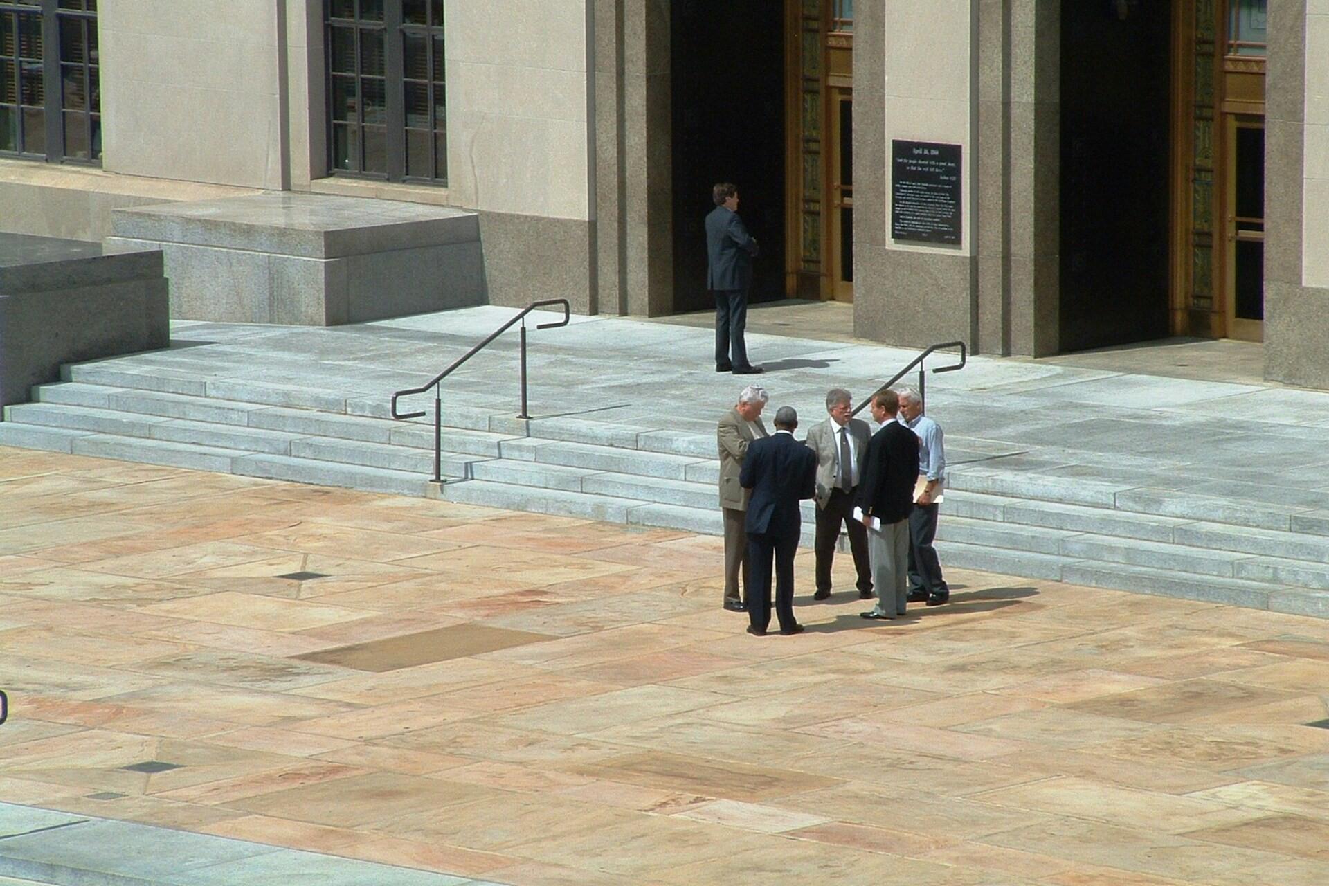 Some lawyers standing outside.